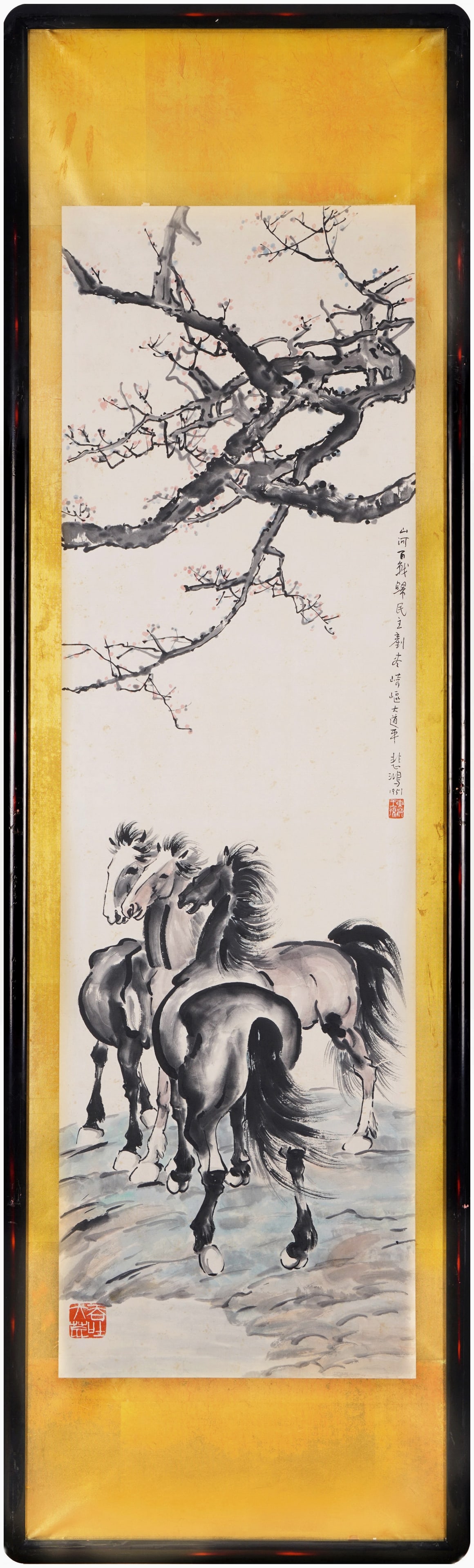 Xu Beihong (1895-1953) Three Steeds Under the Plum Blossom, framed ink and color on paper, dated: 50.8in x 15.0in (129.0cm x 38.0cm)A powerful late work by Xu Beihong, painted in 1951. Three dynamic horses stand beneath a plum tree, rendered in his iconic bold brushwork. Inscribed with patriotic v