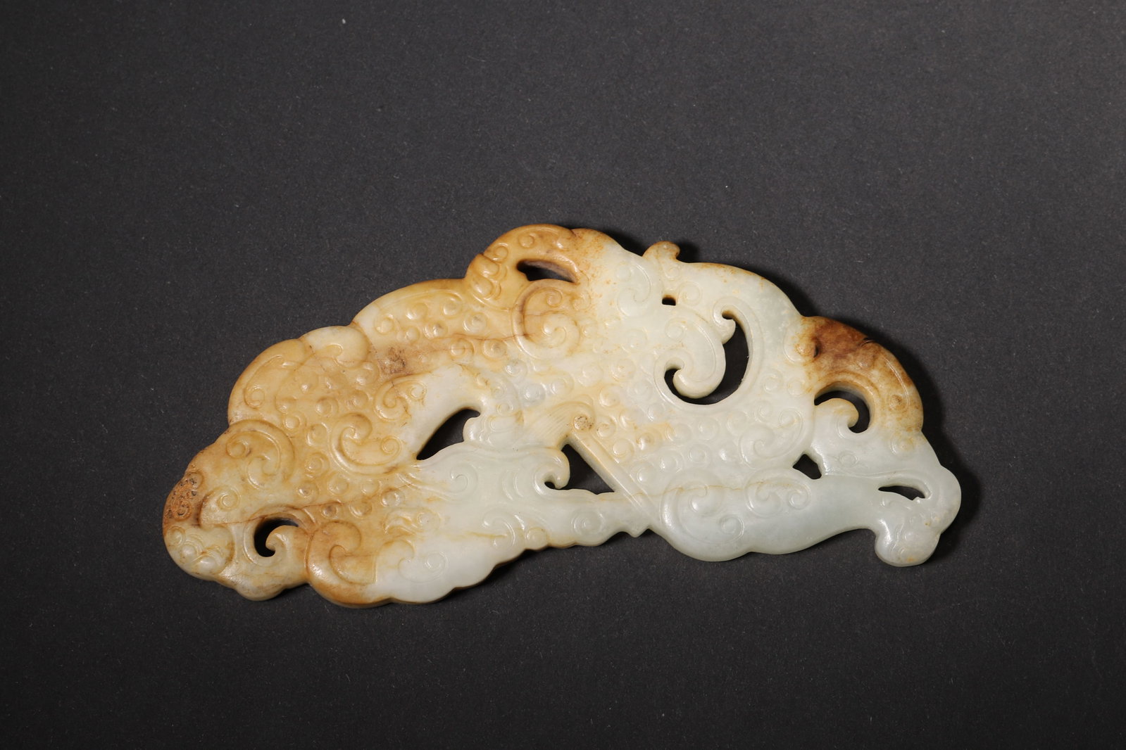 A Han Dynasty Carved Jade Pendant with Dragon and Phoenix Motifs (1 of 7)