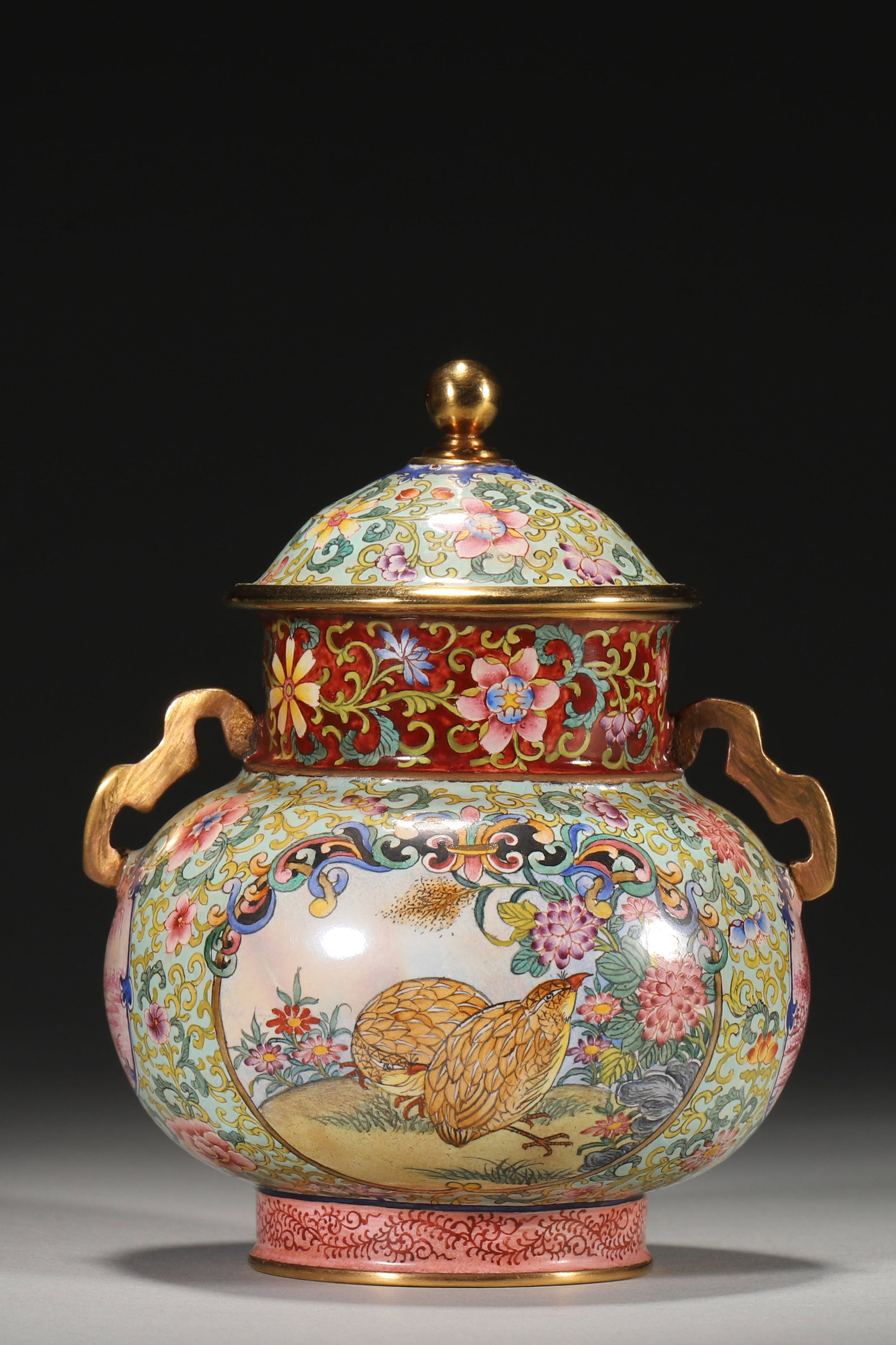 An Enameled Copper Lidded Jar with Bird and Flower Panels, Qianlong Period: 9.0cm x 12.0cm,376.0g (3.54in x 4.72in,WT 0.8289lb)This enameled copper jar features bird and landscape scenes within gilt-framed panels, with a Qianlong mark. It embodies the opulent craftsmanship of