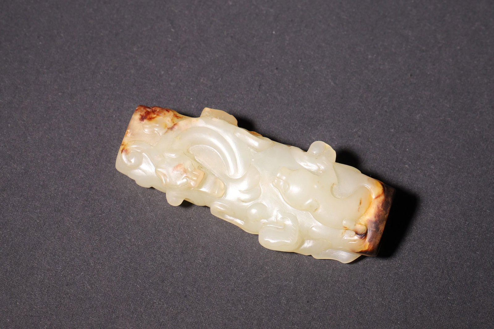 A Hetian Jade Lezi with High-Relief Chilong Pattern - Han Dynasty (1 of 7)
