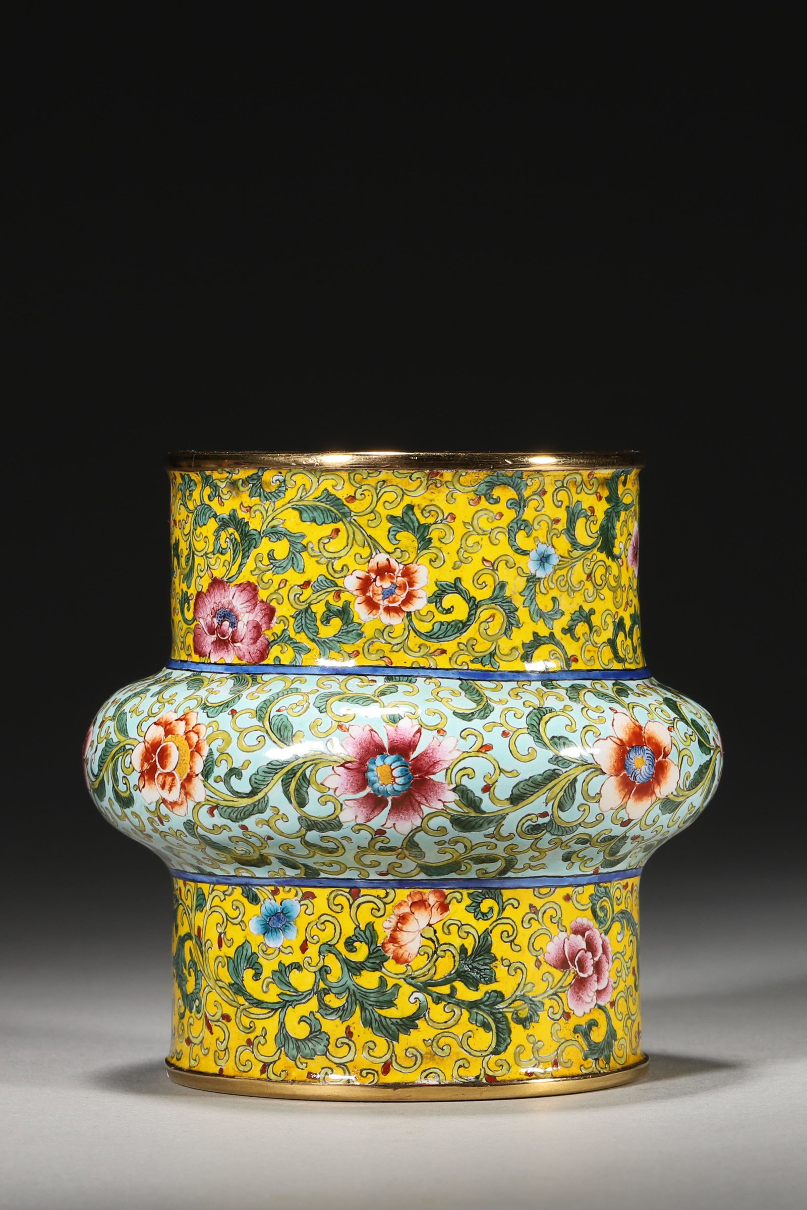 An Enameled Copper Waste Bowl with Floral Scrolls, Qianlong Period: 8.0cm x 8.0cm,362.0g (3.15in x 3.15in,WT 0.7981lb)This enameled copper waste bowl features floral scrolls on multi-colored grounds, with gilt rims and a Qianlong mark. It embodies the opulent style of