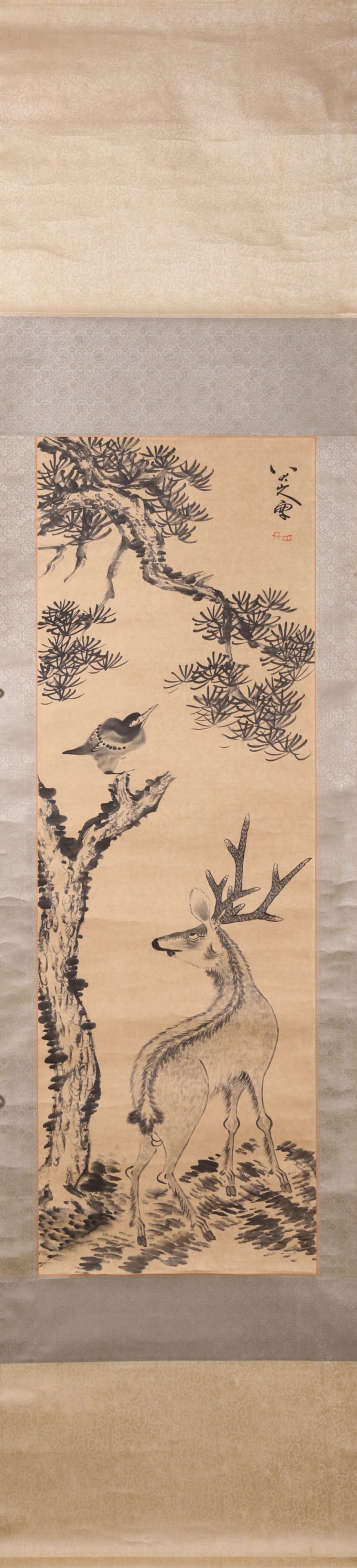 A Paper Scroll Painting of Pine and Deer, Signed Bada Shanren, Qing Dynasty: Core L 105cm (41.34 in); Core W 35cm (13.78 in)A Qing Dynasty paper painting of pine and deer in the style of Bada Shanren, featuring vigorous brushwork and a serene artistic conception. It is a fine 