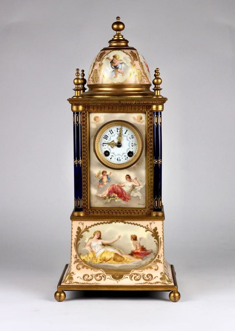 19th-century Vienna porcelain hand-painted mechanical mantel clock: 20x20x46cm,19th-century Vienna porcelain mechanical mantel clock with hand-painted motifs. It features a 7-day power reserve and strikes on the hour and half-hour. Fitted with gilded engraved brass ha