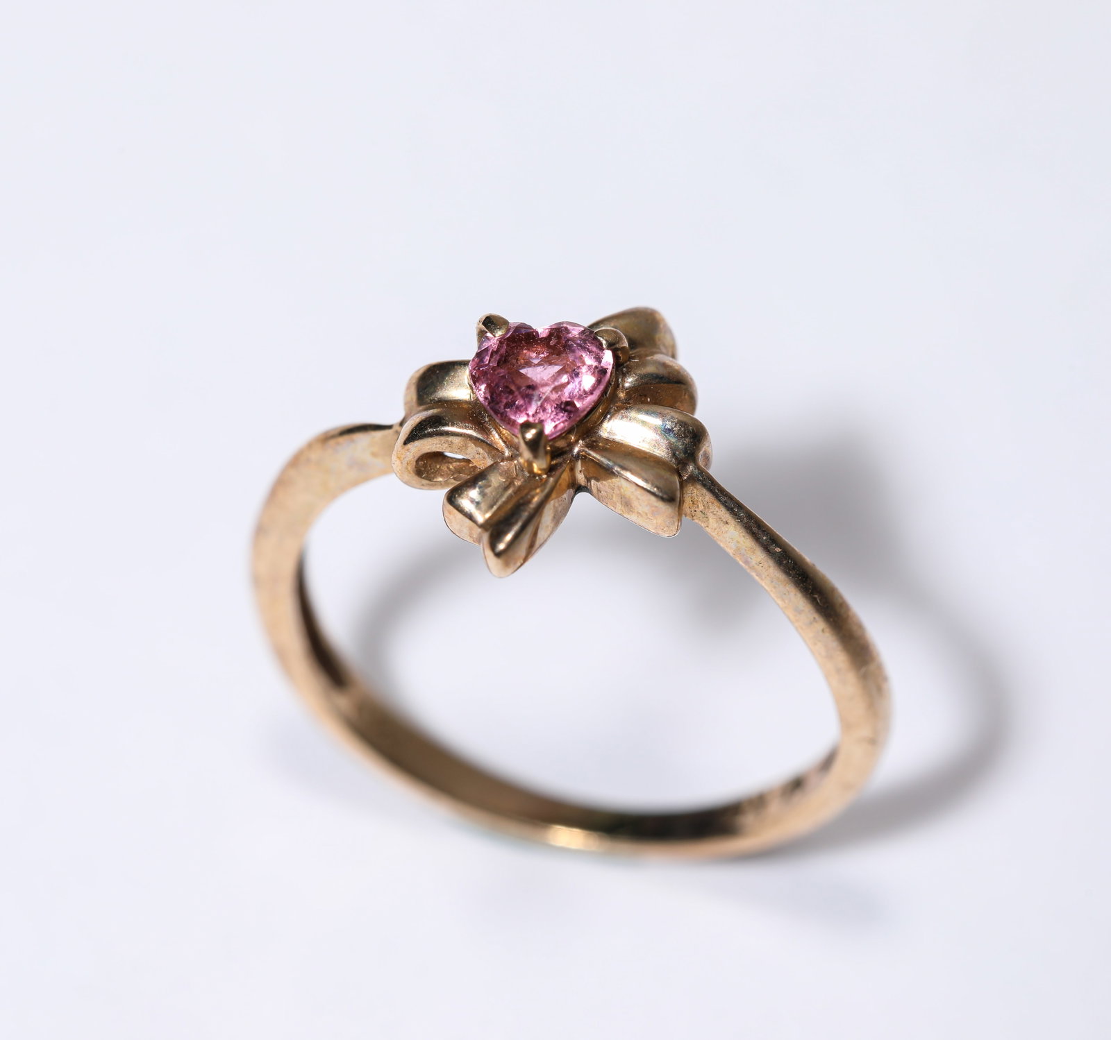 A Pink Diamond and Gold Ring: Dimensions: Weight: 2g. Width: 1.5 cm (0.59 in). All measurements are approximate.