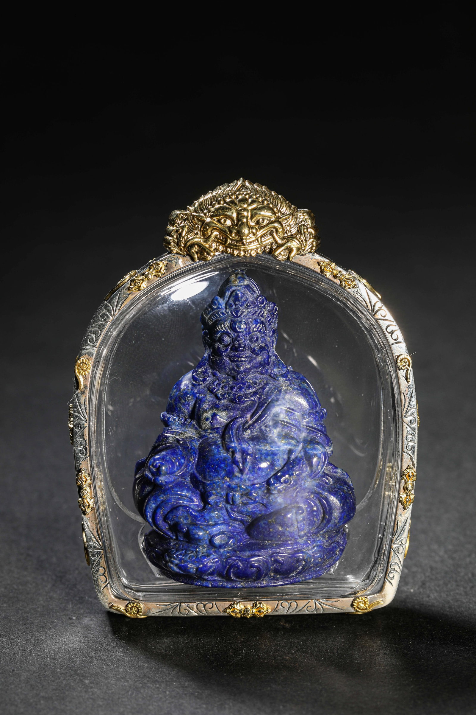 A Lapis Lazuli ??Yellow Jambhala?? Plaque: Dimensions: Length: 6.1 cm (2.40 in) x Width: 3.4 cm (1.34 in) x Height: 7.7 cm (3.03 in). All measurements are approximate.