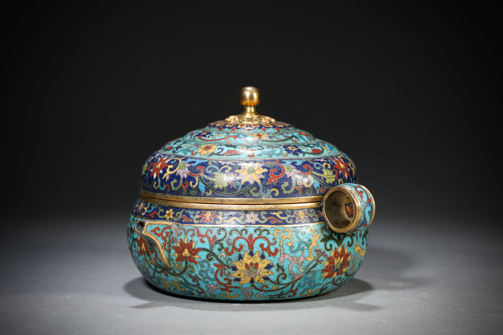 A Cloisonn?? Enamel ??Interlocking Lotus?? Pot: Dimensions: Weight: 930g. Length: 16.4 cm (6.46 in) x Width: 15.9 cm (6.26 in) x Height: 12.3 cm (4.84 in). All measurements are approximate.