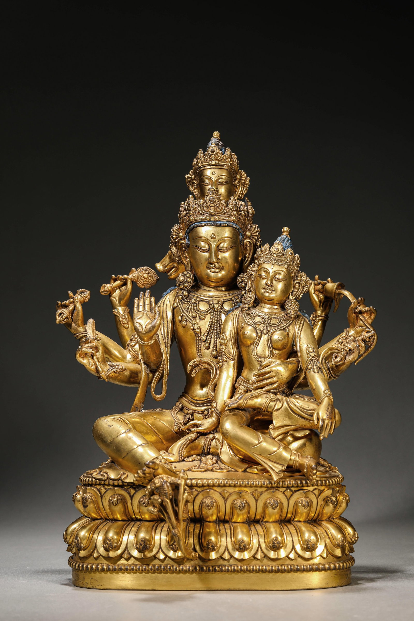 A Gilt-Bronze Figure of Buddha: Dimensions: Weight: 7.5kg. Length: 23.5 cm (9.25 in) x Width: 20.5 cm (8.07 in) x Height: 33.5 cm (13.19 in). All measurements are approximate.