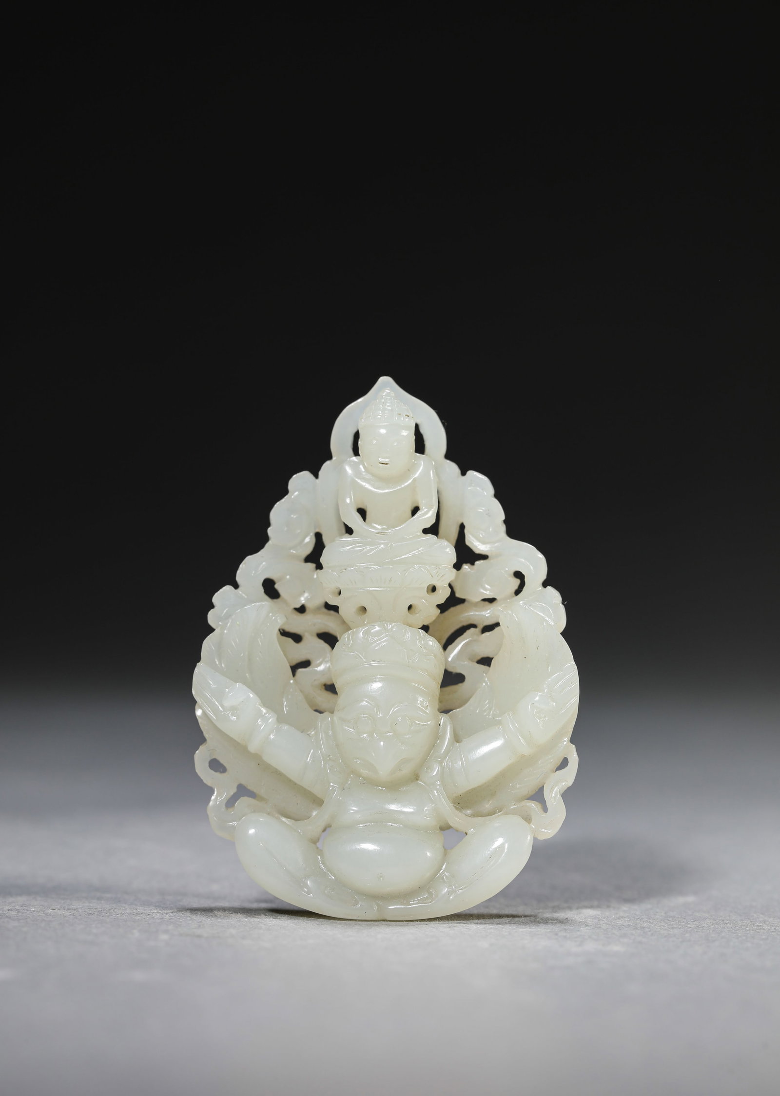 A Jade 'Garuda' Pendant: Dimensions: Width: 4.3 cm (1.69 in) x Height: 6.1 cm (2.40 in). All measurements are approximate.