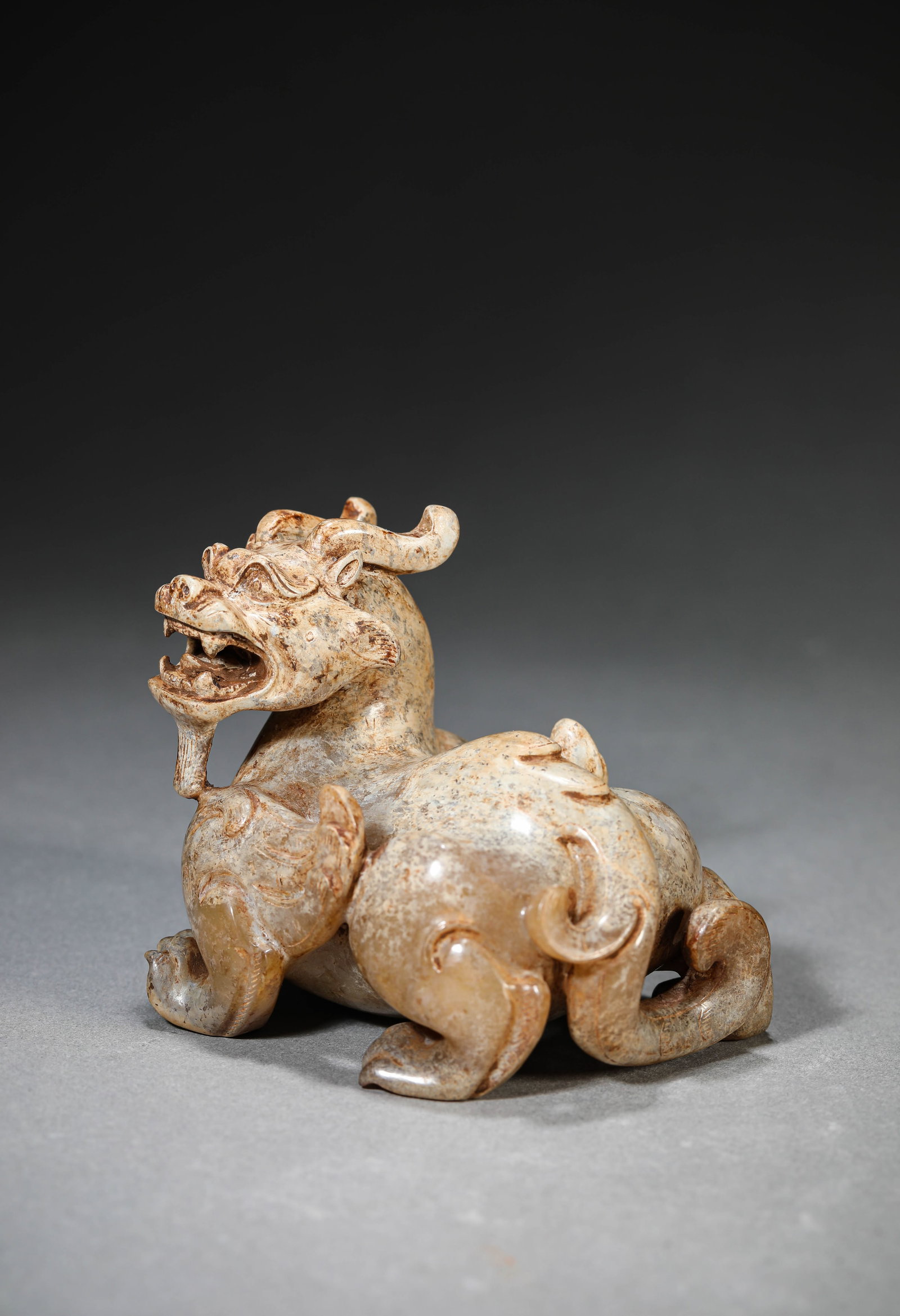 A Jade 'Auspicious Beast' Ornament: Dimensions: Length: 7.8 cm (3.07 in) x Width: 6.2 cm (2.44 in) x Height: 6.7 cm (2.64 in). All measurements are approximate.