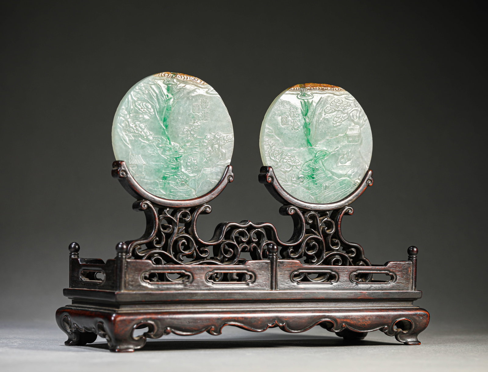 A Jadeite 'Carved Narrative Scene' Table Screen: Dimensions: Length: 20.6 cm (8.11 in) x Width: 8.2 cm (3.23 in) x Height: 16.3 cm (6.42 in). All measurements are approximate.