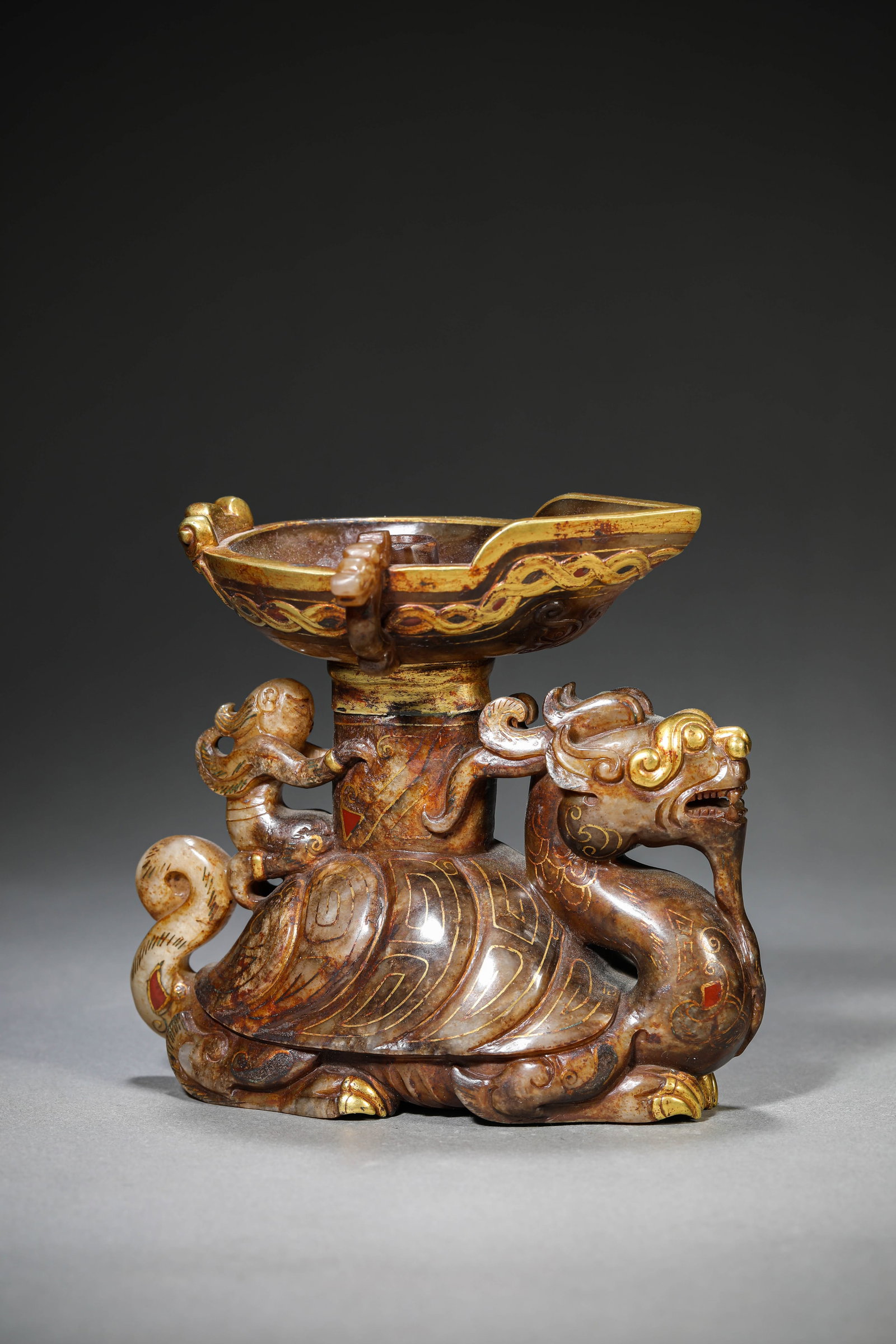 A Jade Candleholder: Dimensions: Length: 13.5 cm (5.31 in) x Width: 7.9 cm (3.11 in) x Height: 12.3 cm (4.84 in). All measurements are approximate.