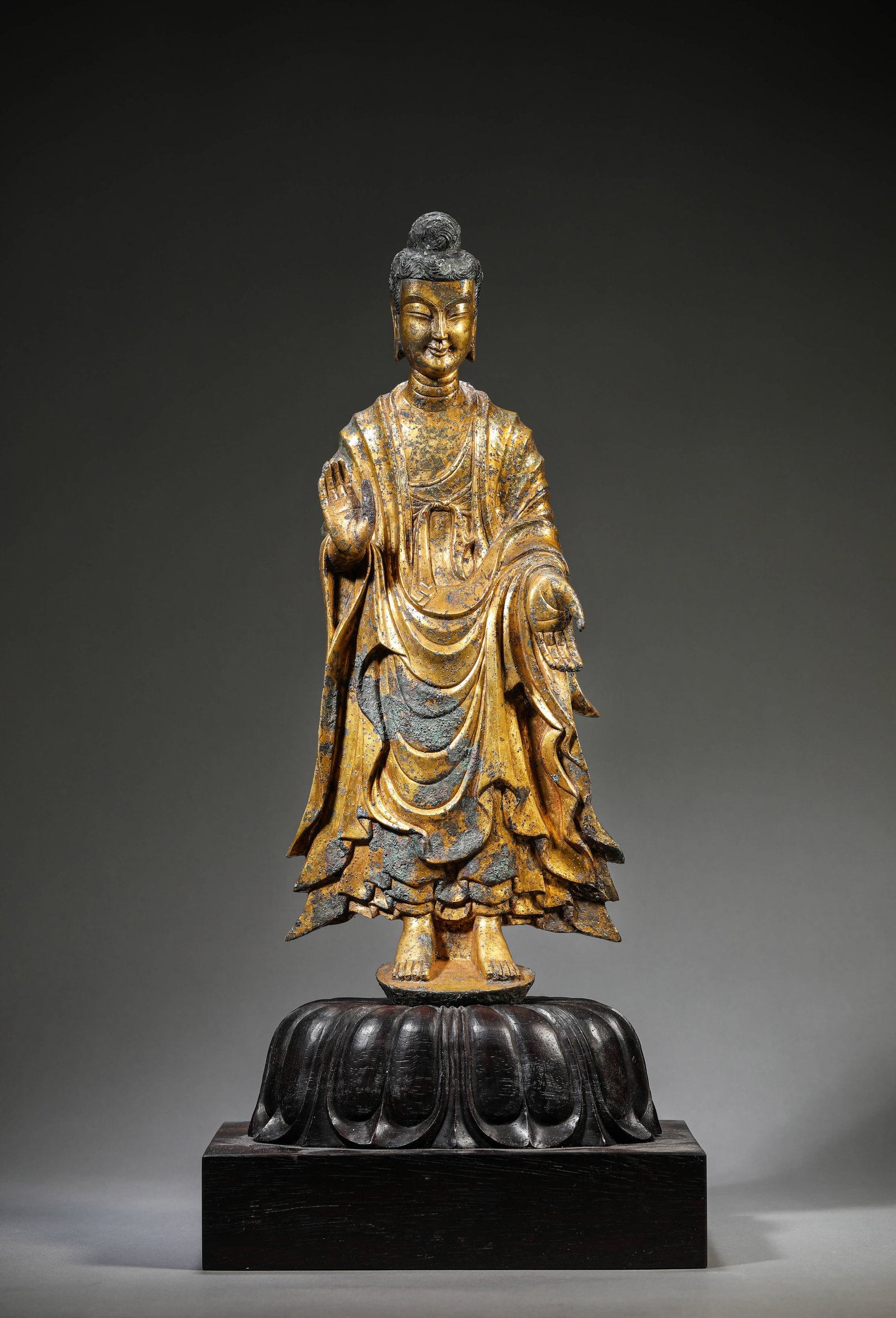 A Gilt-Bronze Figure of Buddha: Dimensions: Weight: 2821g. Length: 14.9 cm (5.87 in) x Width: 9.0 cm (3.54 in) x Height: 39.5 cm (15.55 in). All measurements are approximate.