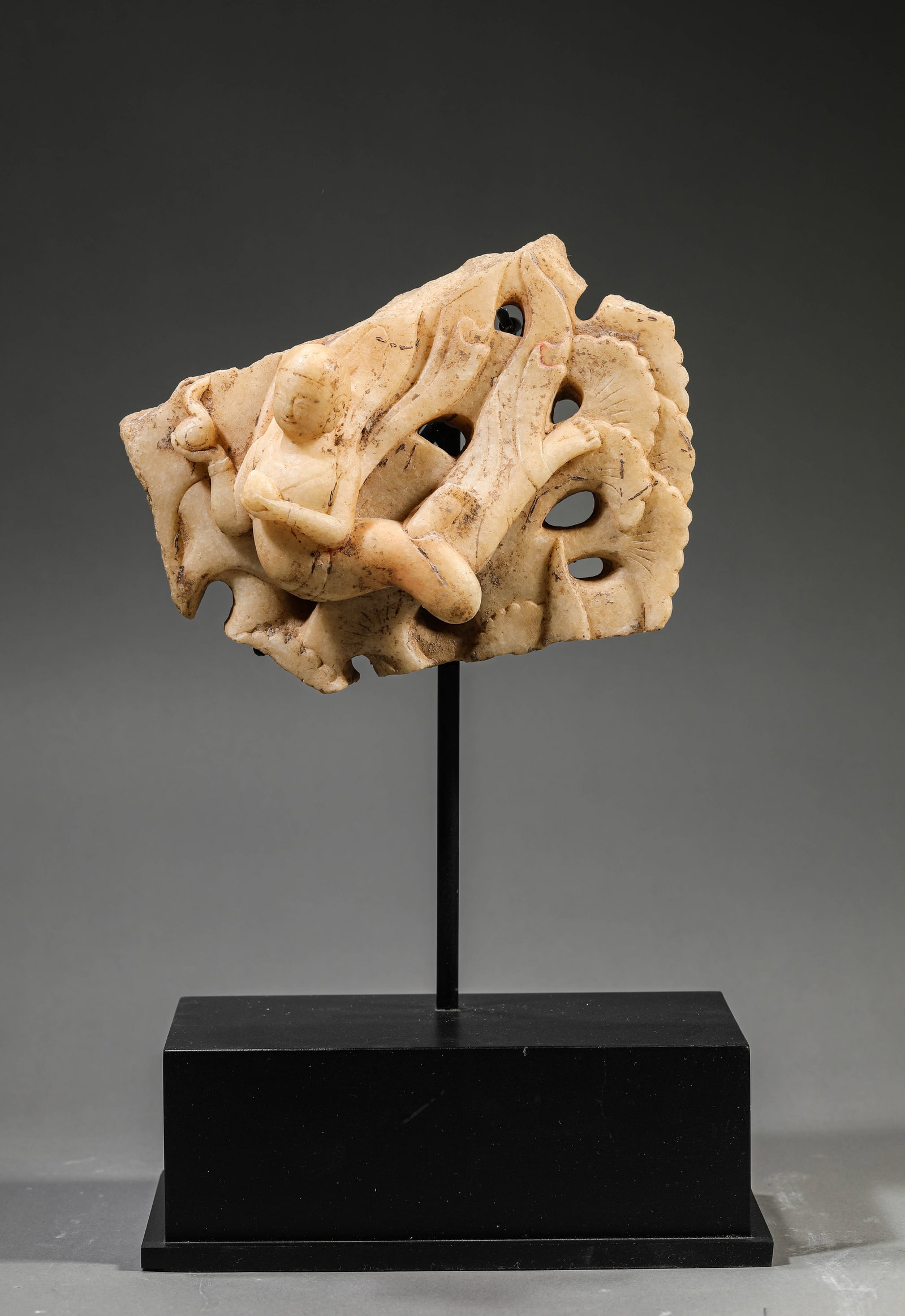 A White Marble 'Flying Apsara': Dimensions: Weight: 2.5kg. Length: 20.5 cm (8.07 in) x Width: 7.5 cm (2.95 in) x Height: 16.0 cm (6.30 in). All measurements are approximate.