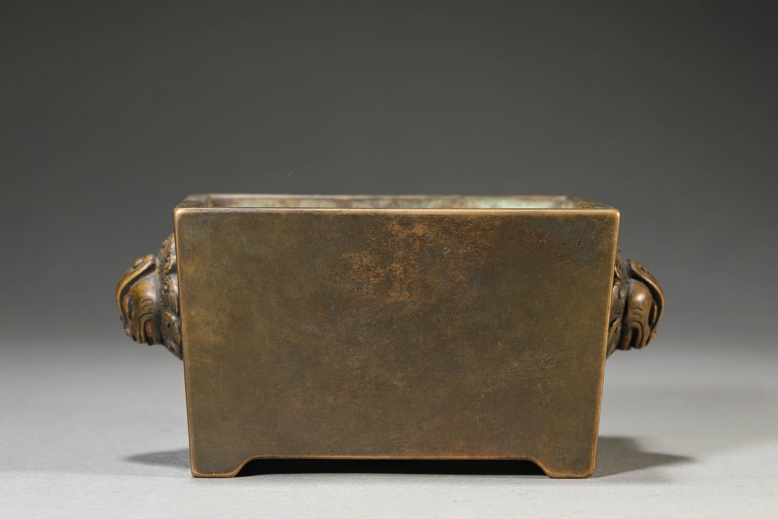 A Bronze ??Heavenly Chicken Handles?? ??Trough-Form?? Censer: Dimensions: Weight: 2467g. Length: 17.3 cm (6.81 in) x Width: 9.6 cm (3.78 in) x Height: 8.2 cm (3.23 in). All measurements are approximate.