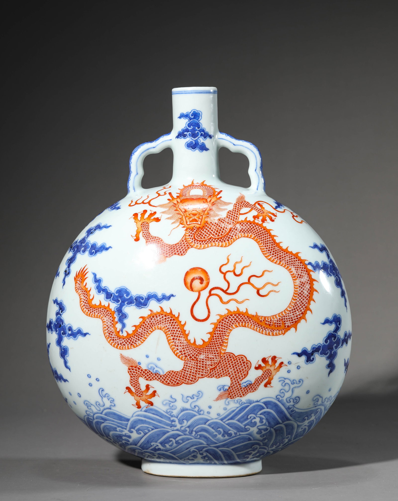 A Blue and White and Iron-Red 'Dragon' 'Moonflask': Dimensions: Length: 24.7 cm (9.72 in) x Width: 13.9 cm (5.47 in) x Height: 31.8 cm (12.52 in). All measurements are approximate.