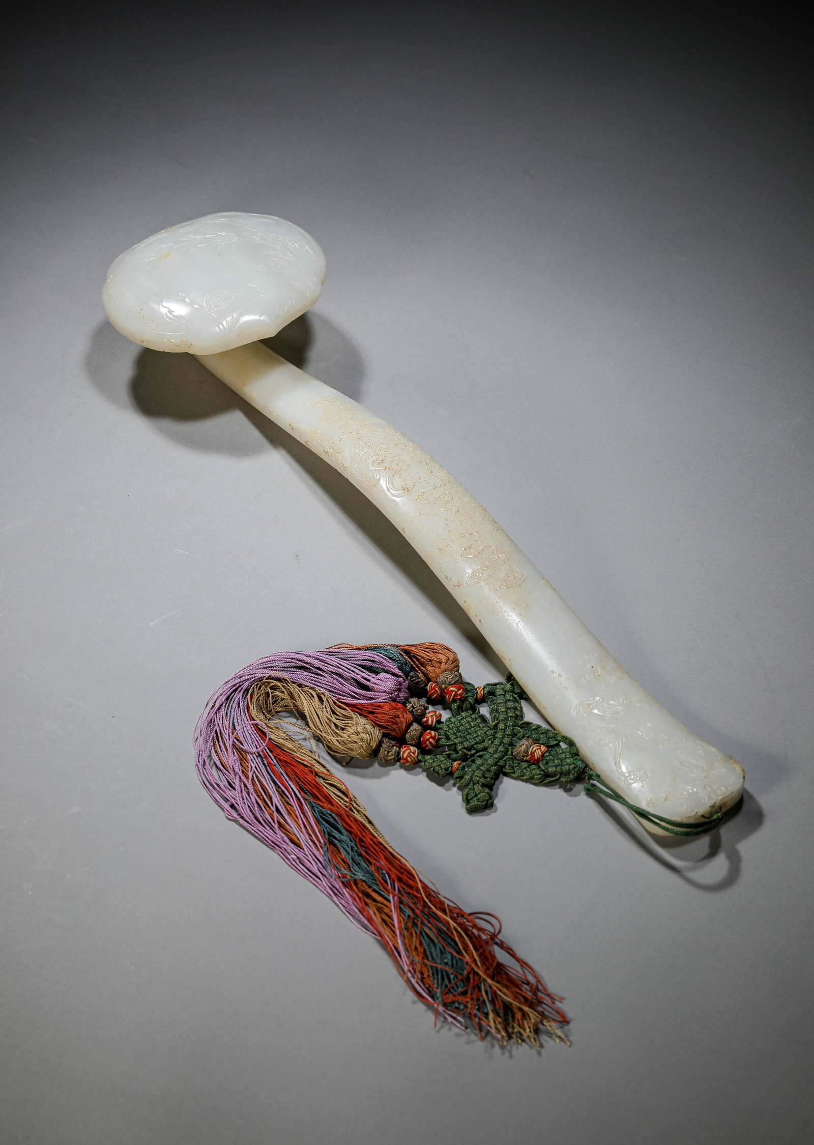 A Jade 'Domestic Bliss' Ruyi Sceptre: Dimensions: Length: 40.5 cm (15.94 in) x Width: 10.2 cm (4.02 in) x Height: 5.5 cm (2.17 in). All measurements are approximate.