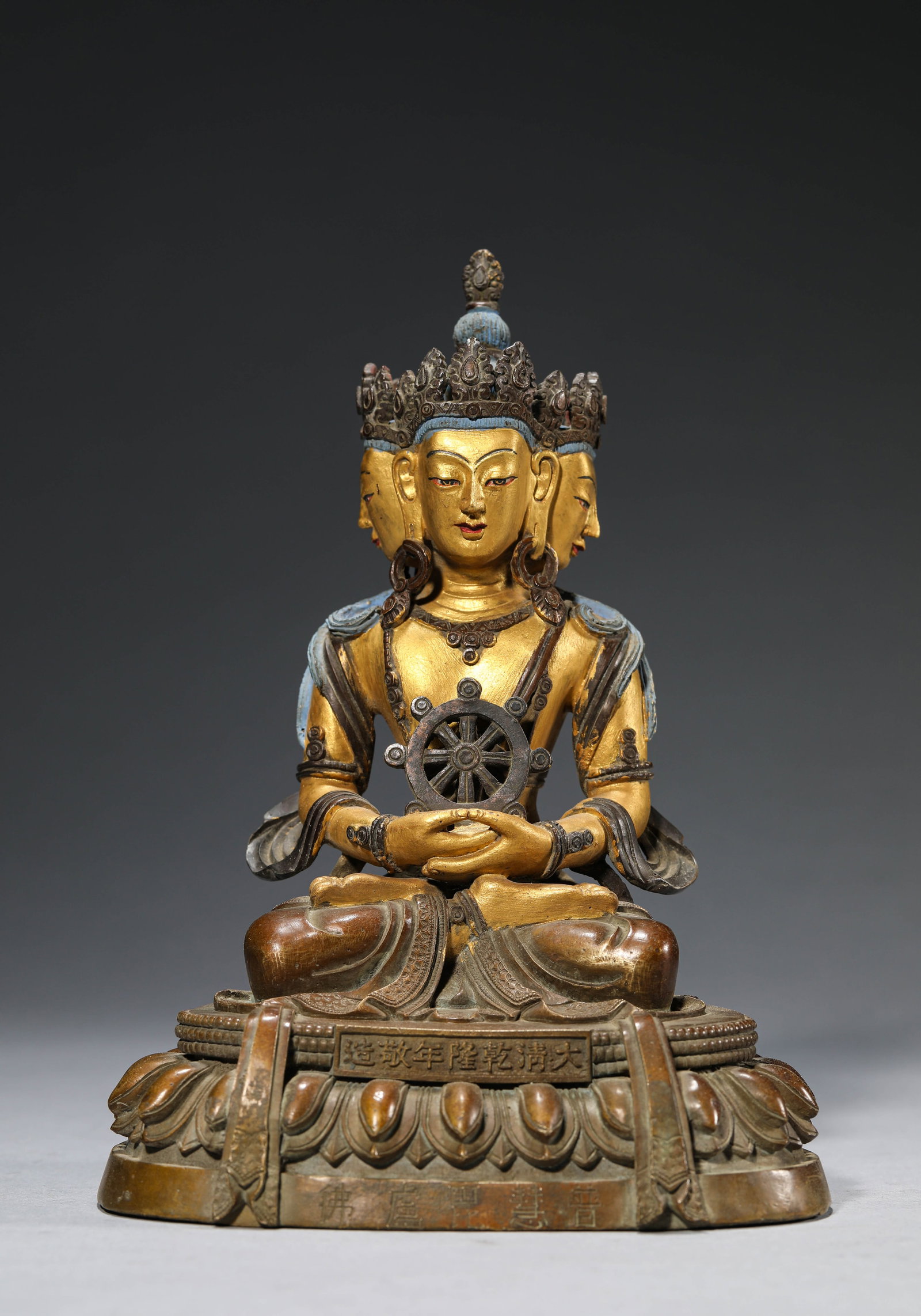A Gilt-Bronze Figure of Vairochana: Dimensions: Weight: 2010g. Length: 14.7 cm (5.79 in) x Width: 11.2 cm (4.41 in) x Height: 19.5 cm (7.68 in). All measurements are approximate.