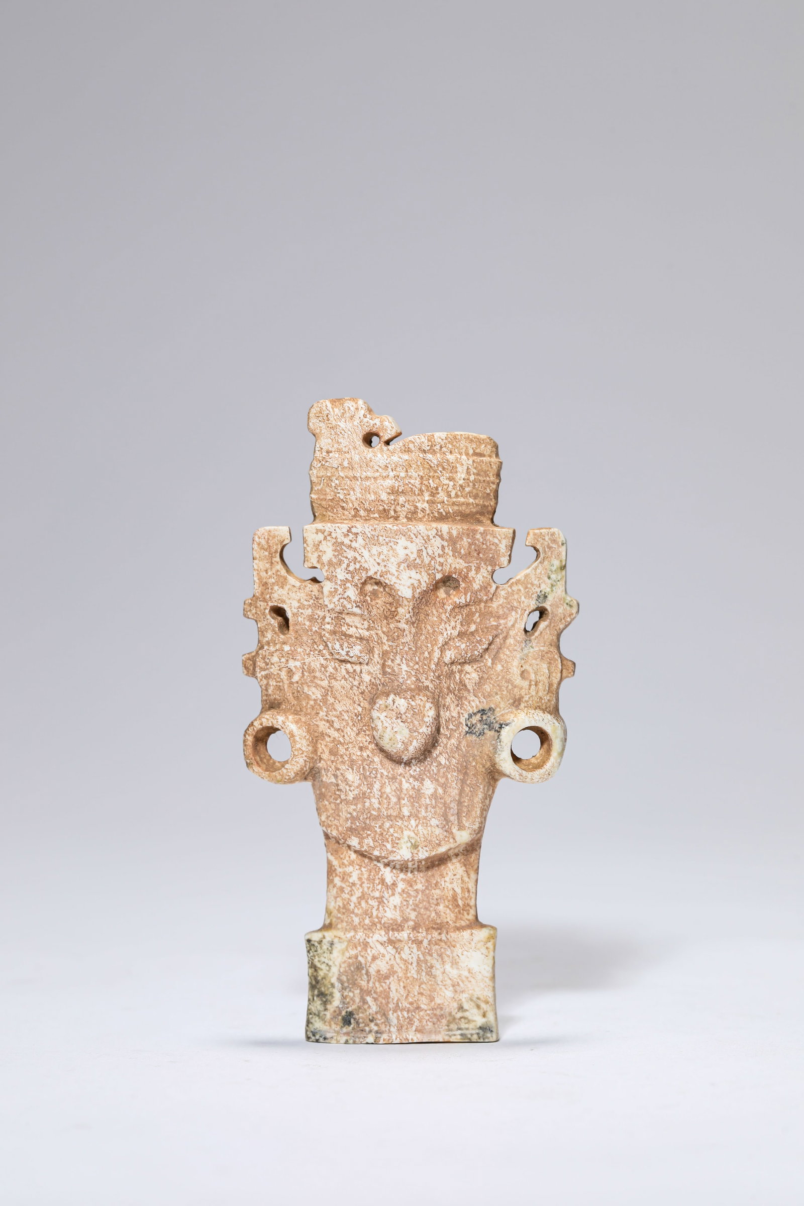 A Jade 'Ancestor Head': Dimensions: Width: 5.0 cm (1.97 in) x Height: 9.6 cm (3.78 in). All measurements are approximate.