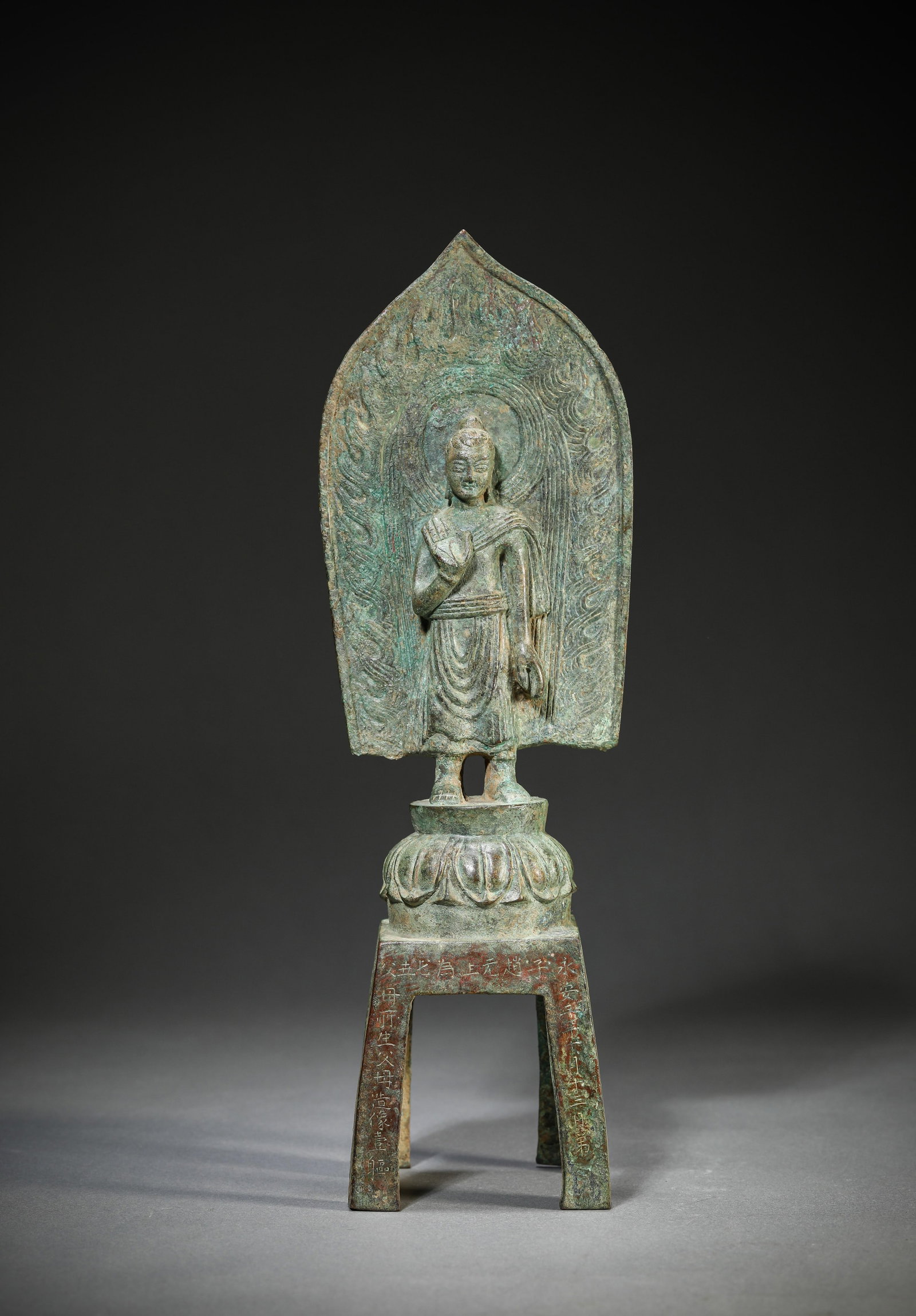A Bronze Figure of Buddha: Dimensions: Weight: 970g. Length: 9.0 cm (3.54 in) x Width: 6.8 cm (2.68 in) x Height: 27.7 cm (10.91 in). All measurements are approximate.