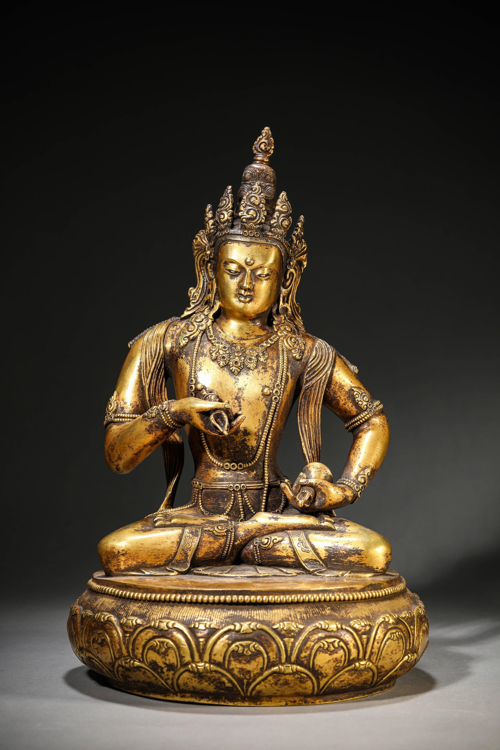 A Gilt-Bronze Figure of Vajrasattva: Dimensions: Weight: 6.1kg. Width: 21.1 cm (8.31 in) x Height: 33.0 cm (12.99 in). All measurements are approximate.