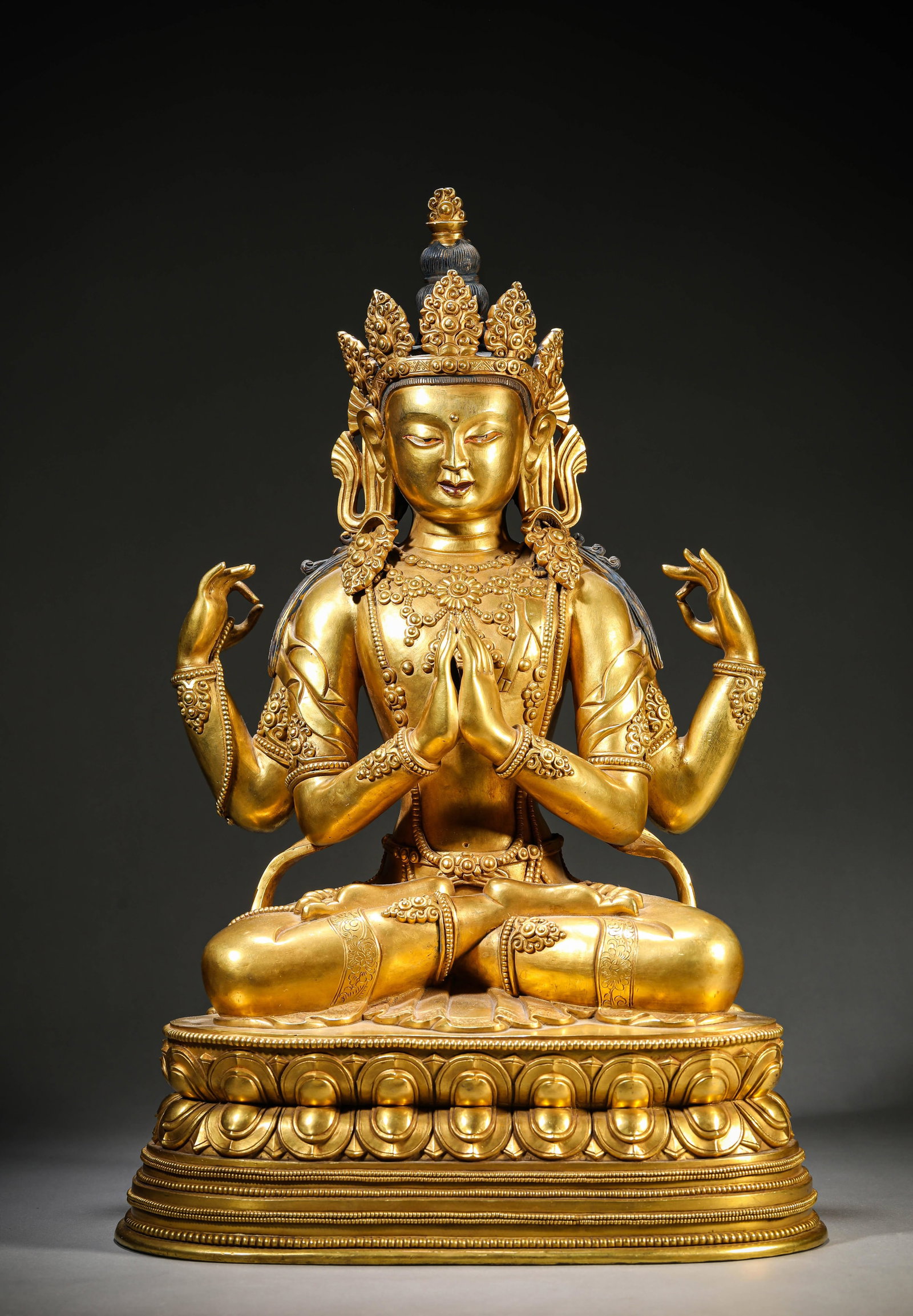 A Gilt-Bronze Figure of Four-Armed Avalokiteshvara: Dimensions: Weight: 13.2kg. Length: 29.8 cm (11.73 in) x Width: 20.8 cm (8.19 in) x Height: 46.3 cm (18.23 in). All measurements are approximate.
