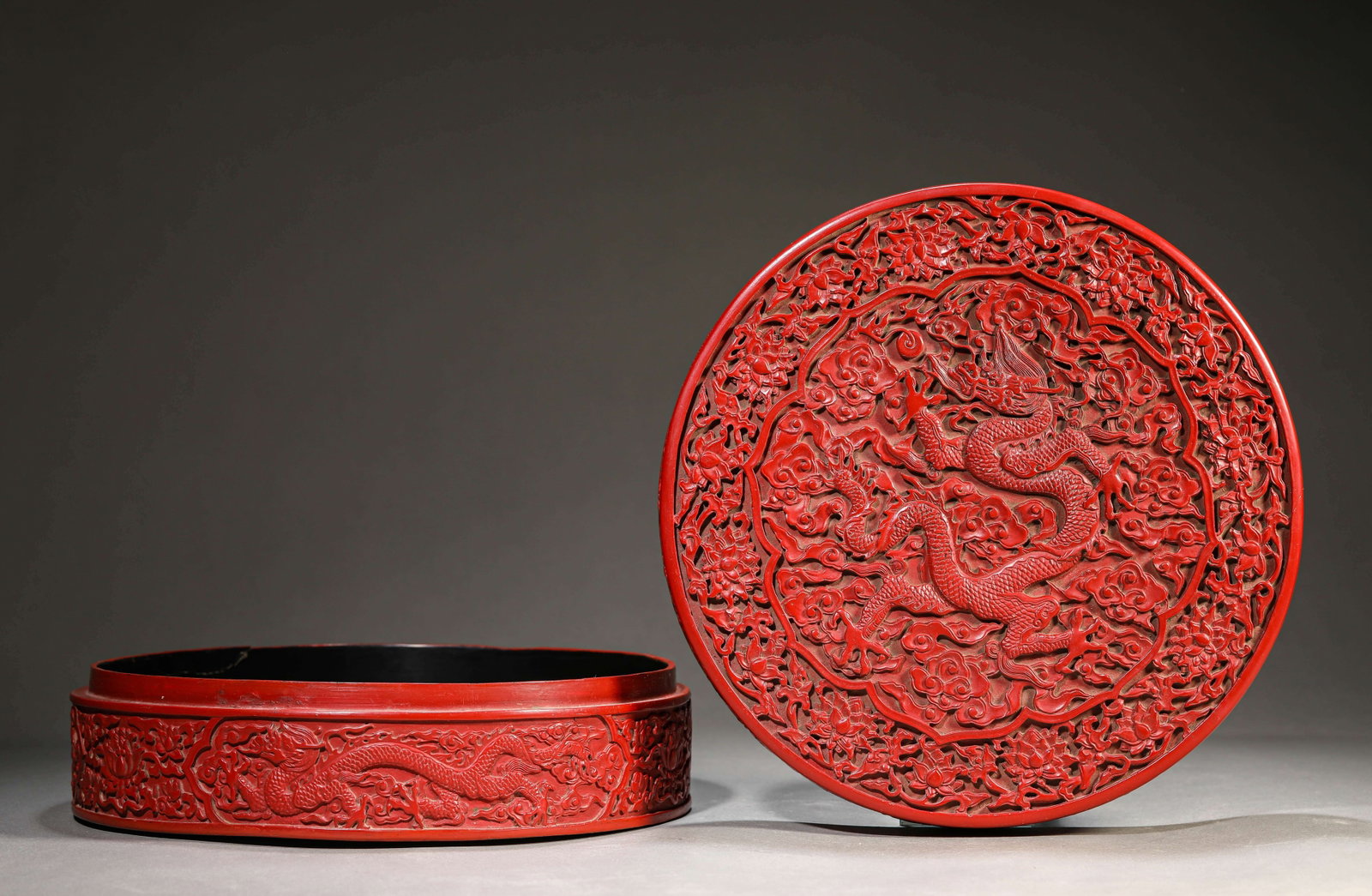 A Carved Cinnabar Lacquer ??Dragon?? Covered Box: Dimensions: Width: 23.5 cm (9.25 in) x Height: 9.0 cm (3.54 in). All measurements are approximate.
