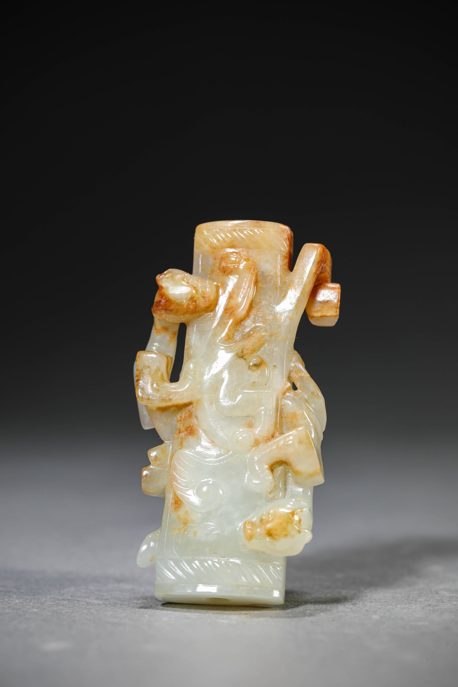 A Jade 'Chi-Dragon' Pendant: Dimensions: Length: 3.3 cm (1.30 in) x Width: 1.4 cm (0.55 in) x Height: 6.4 cm (2.52 in). All measurements are approximate.