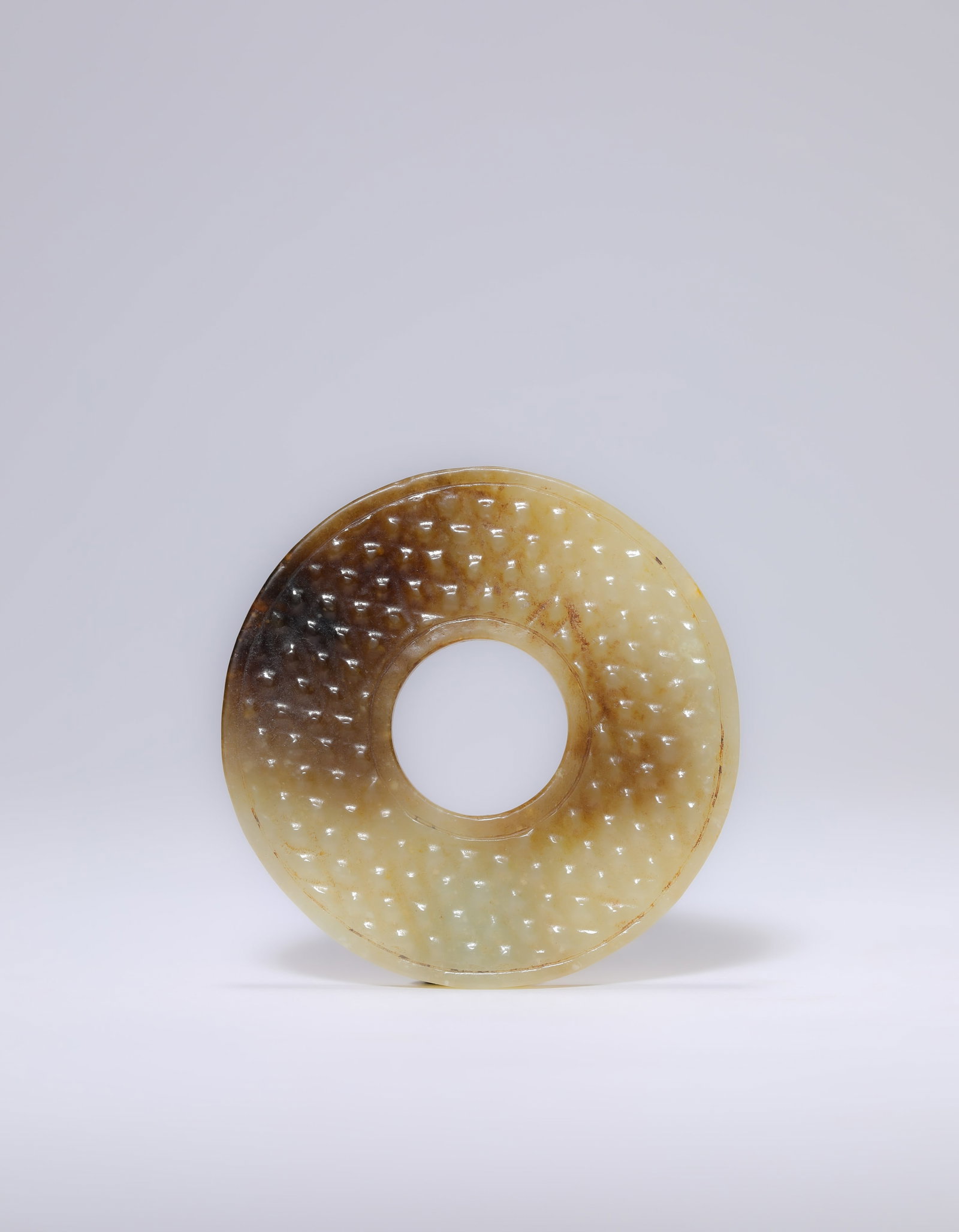 A Jade Bi Disc: Dimensions: Width: 5.5 cm (2.17 in). All measurements are approximate.