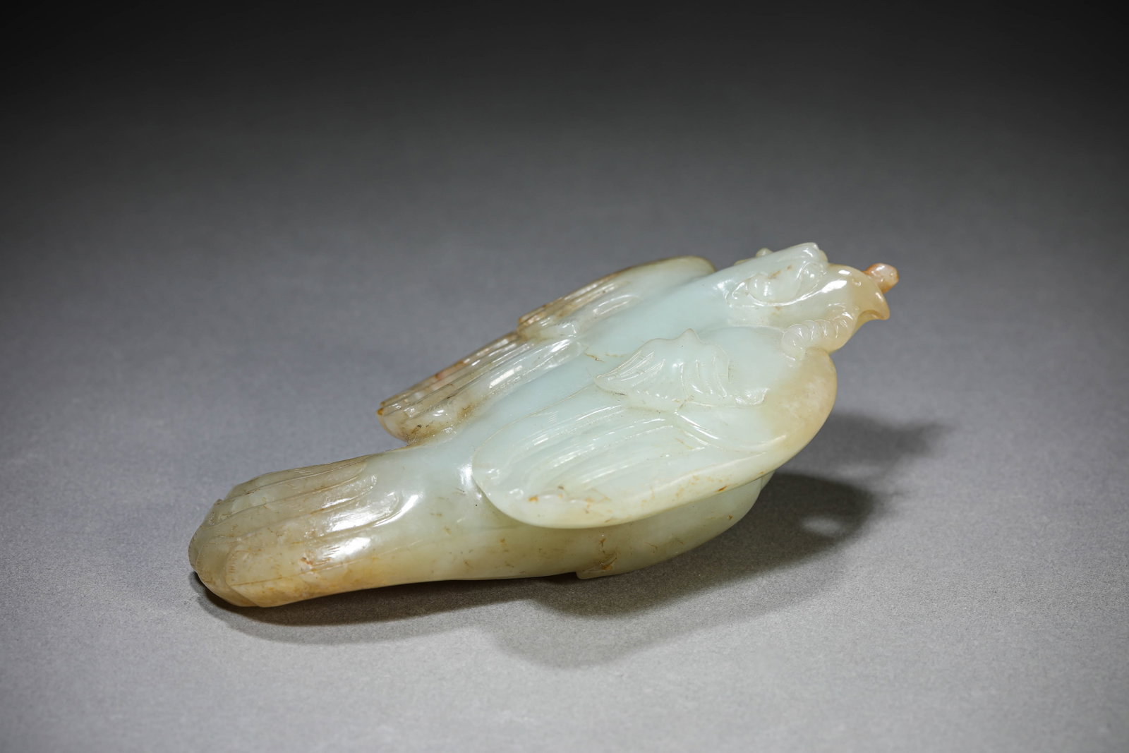 A Jade Bird: Dimensions: Length: 12.5 cm (4.92 in) x Width: 7.2 cm (2.83 in) x Height: 3.7 cm (1.46 in). All measurements are approximate.