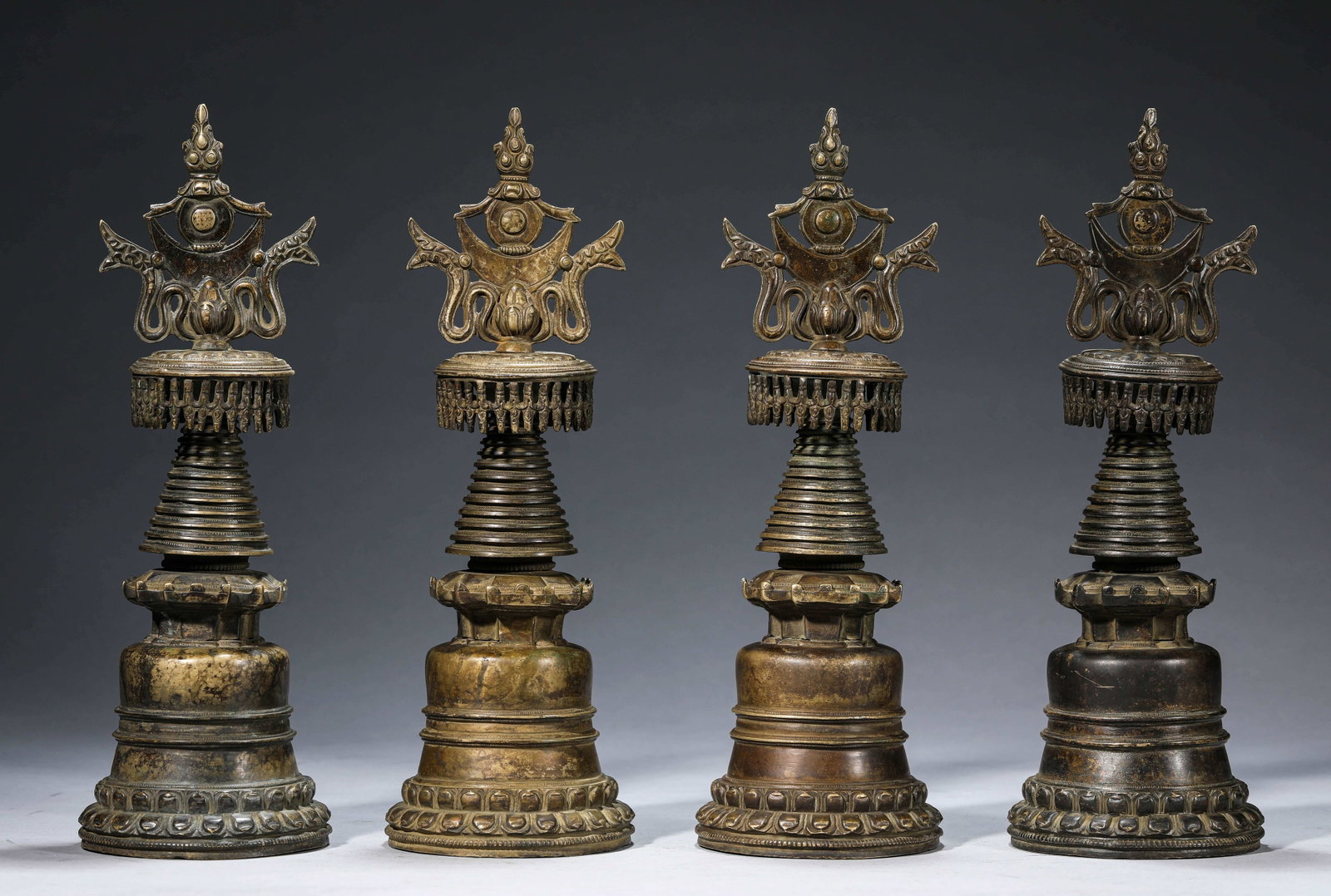 A Group of ??Tibetan Kadam-Style?? Alloy Bronze Stupas: Dimensions: Weight: 5.1kg. Width: 10.5 cm (4.13 in) x Height: 30.3 cm (11.93 in). All measurements are approximate.