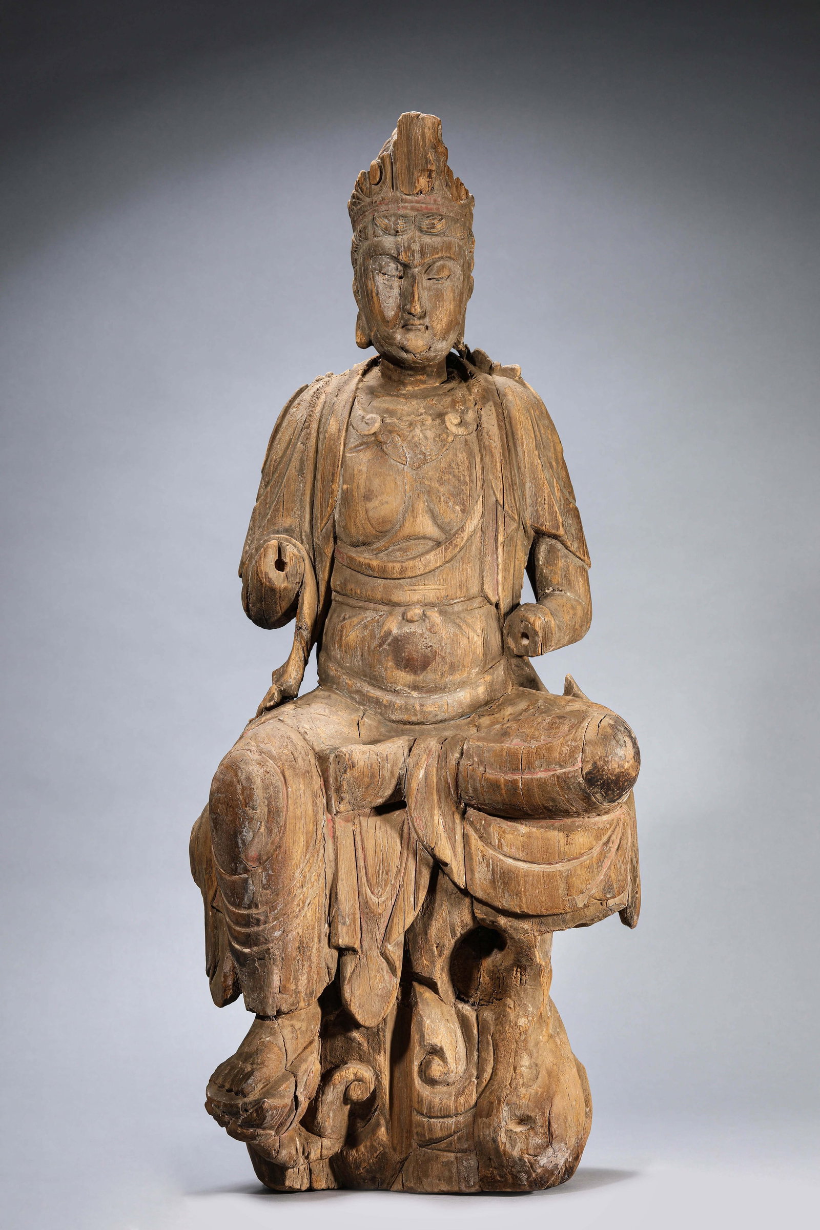 A Wood Seated Figure of Avalokiteshvara: Dimensions: Length: 33.6 cm (13.23 in) x Width: 27.2 cm (10.71 in) x Height: 82.0 cm (32.28 in). All measurements are approximate.