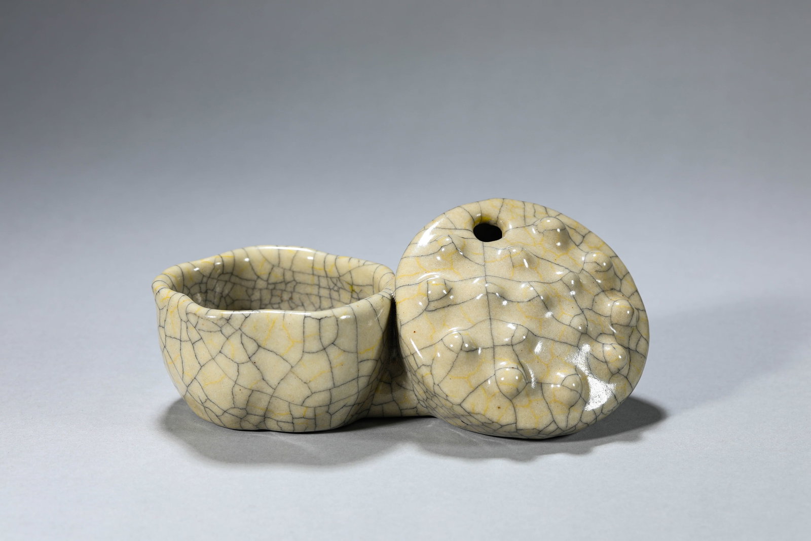 A Ge-Type 'Lotus Pod' Water Pot: Dimensions: Length: 16.8 cm (6.61 in) x Width: 7.8 cm (3.07 in) x Height: 6.5 cm (2.56 in). All measurements are approximate.