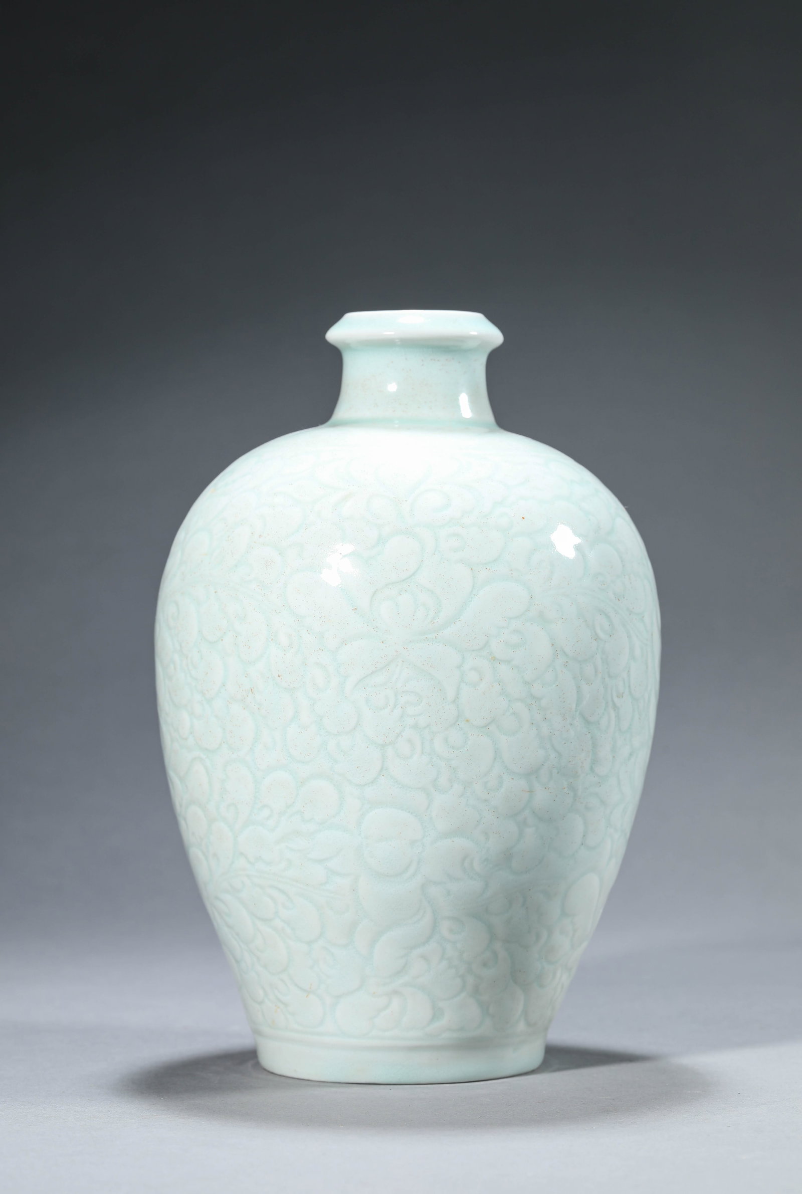 A Hutian-Type 'Carved Floral' Meiping: Dimensions: Width: 14.4 cm (5.67 in) x Height: 21.8 cm (8.58 in). All measurements are approximate.