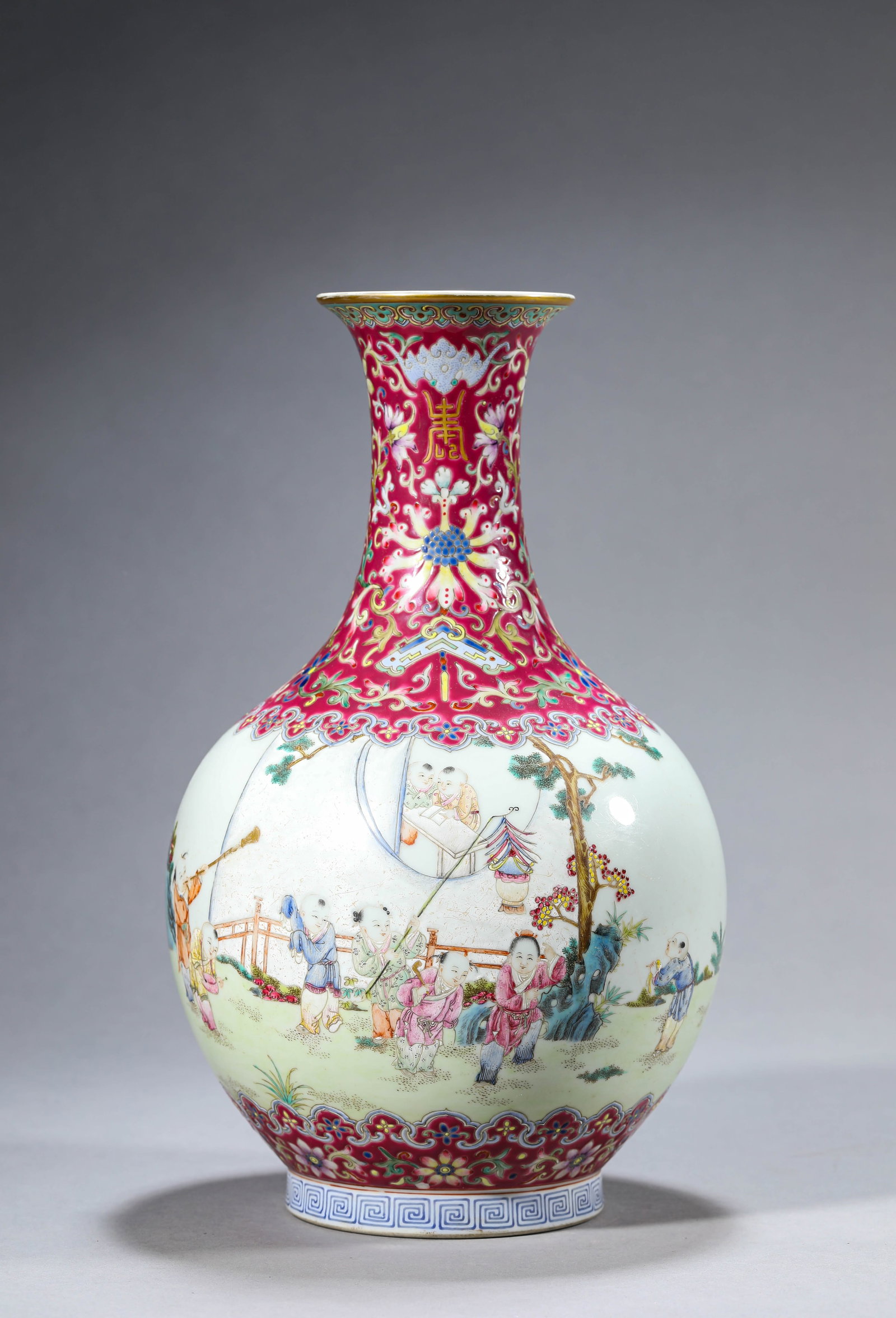 A Rouge-Ground Famille-Rose 'Children at Play' Vase: Dimensions: Width: 17.2 cm (6.77 in) x Height: 30.0 cm (11.81 in). All measurements are approximate.