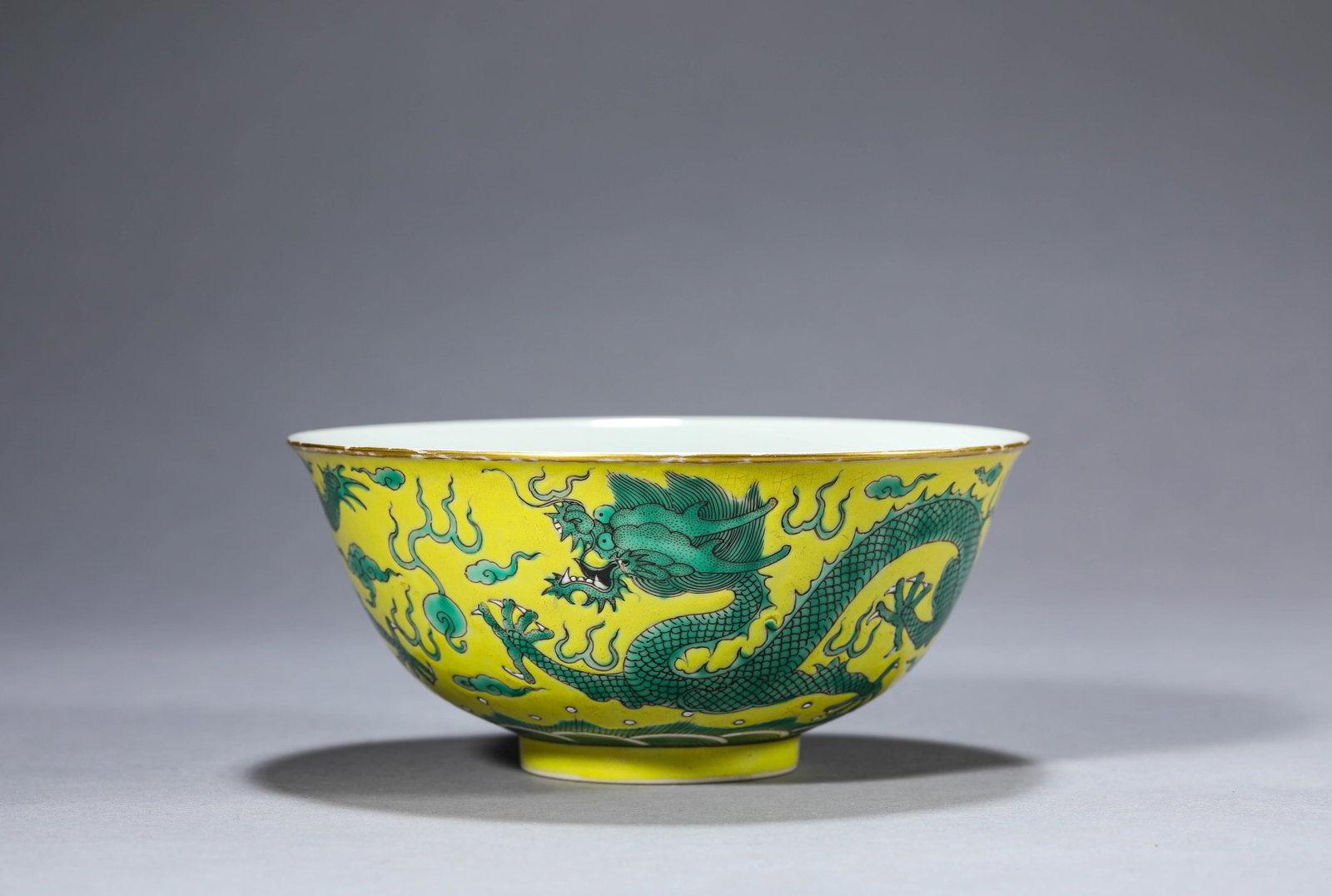 A Yellow-Ground Green-Glazed 'Dragon Chasing a Pearl' Bowl: Dimensions: Width: 15.0 cm (5.91 in) x Height: 6.7 cm (2.64 in). All measurements are approximate.