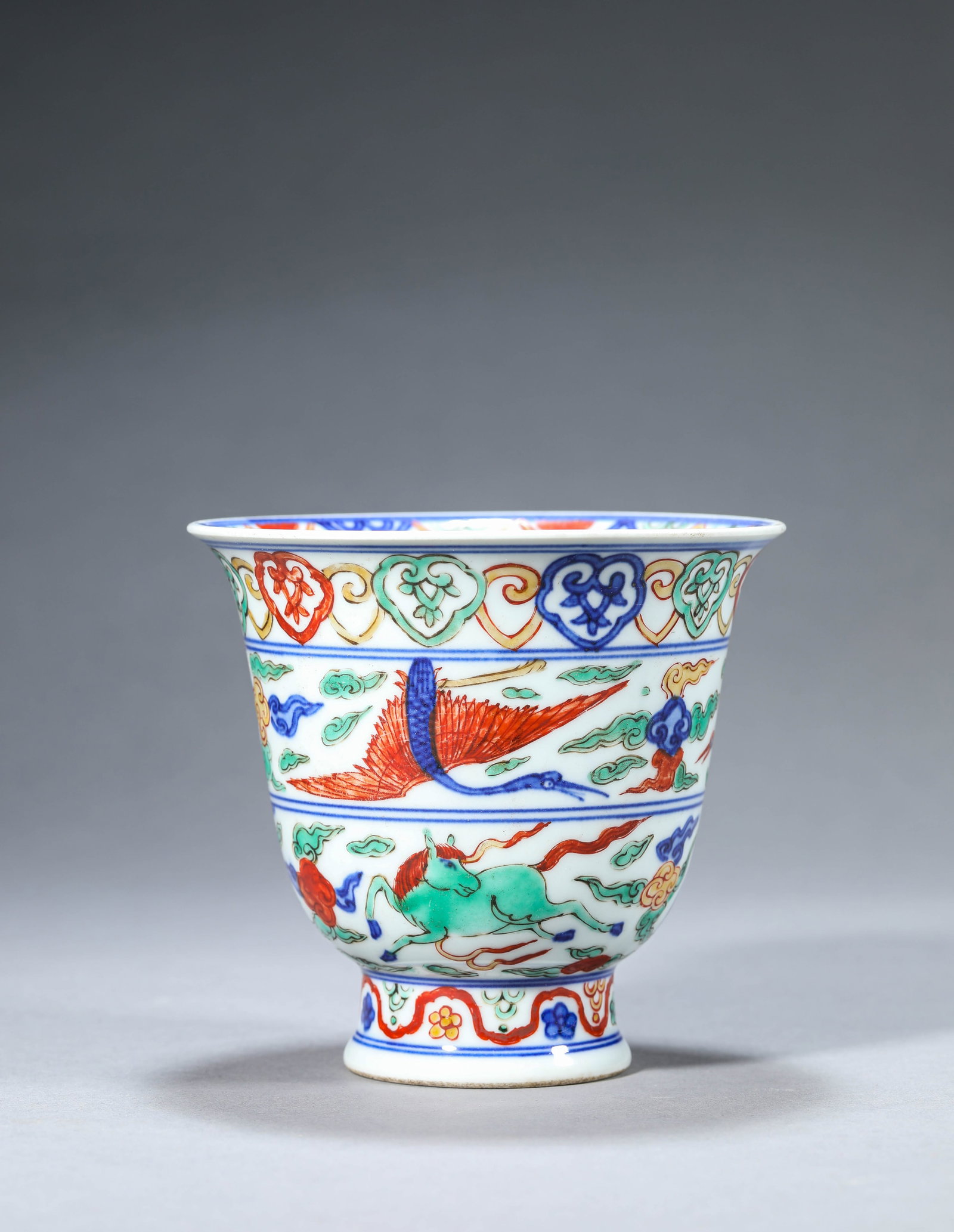 A Wucai 'Flying Horse and Clouds' Cup: Dimensions: Width: 12.3 cm (4.84 in) x Height: 11.4 cm (4.49 in). All measurements are approximate.