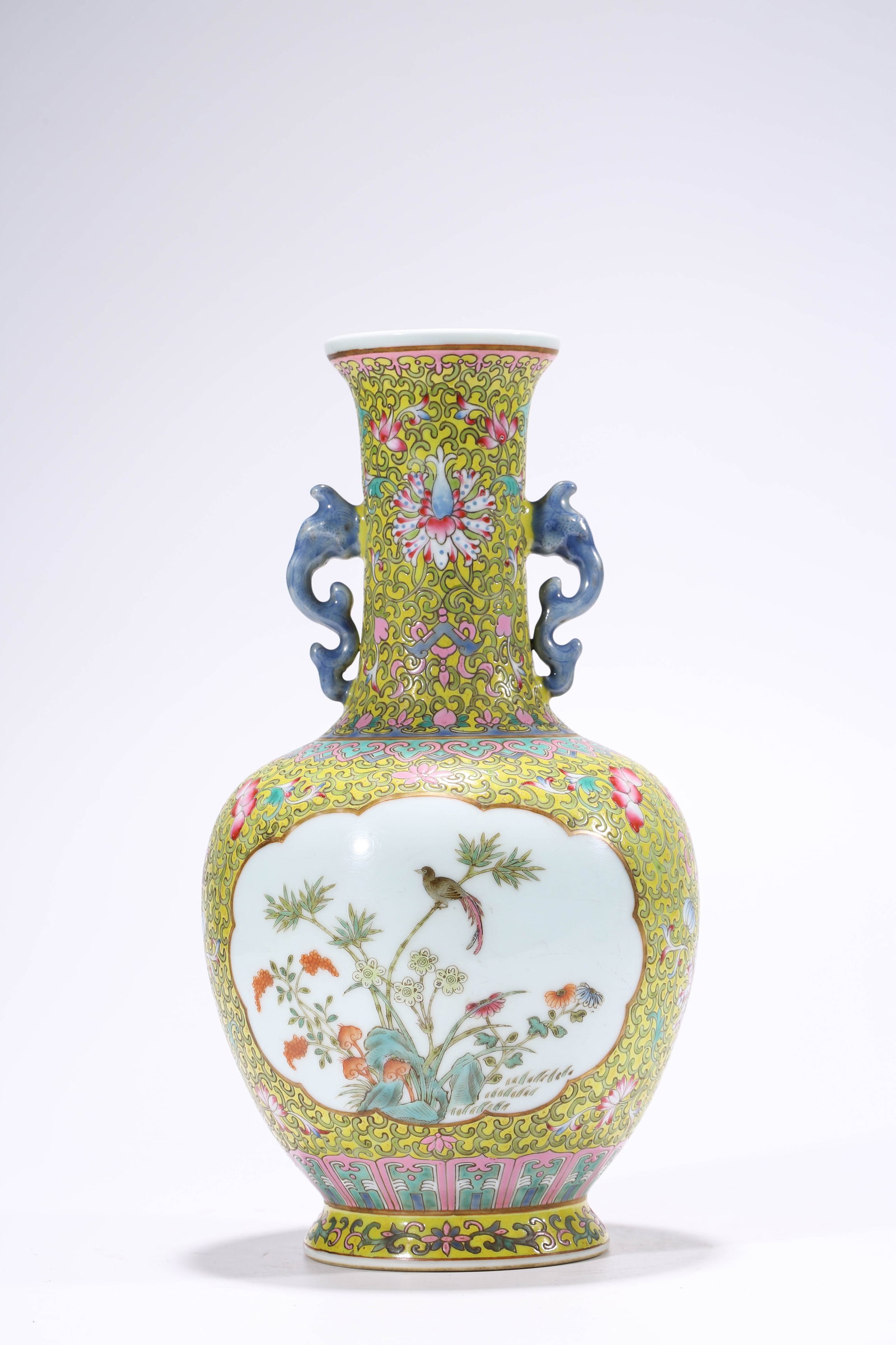 A Yellow-Ground Famille-Rose ??Interlocking Florals and Flower-Bird Reserves?? ??Reward?? Vase: Dimensions: Width: 16.5 cm (6.50 in) x Height: 30.5 cm (12.01 in). All measurements are approximate.