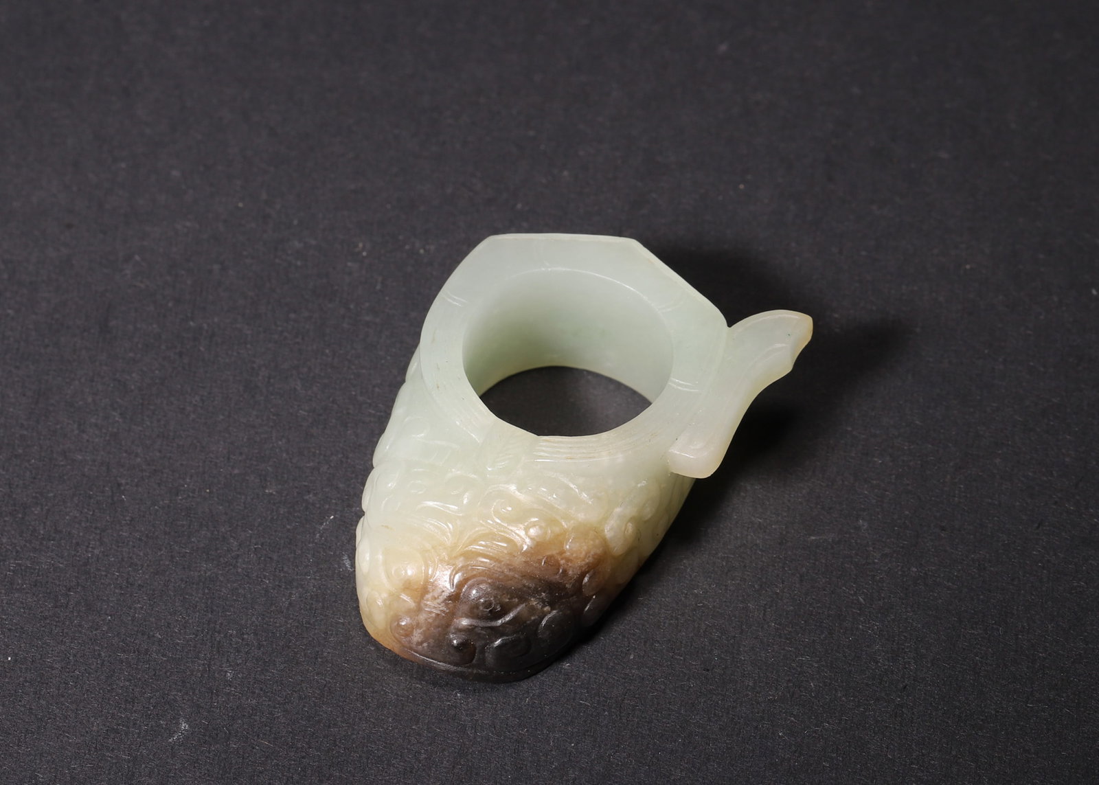A Hetian White Jade She (Thumb Ring) with Beast-Mask Pattern, Han Dynasty (1 of 6)