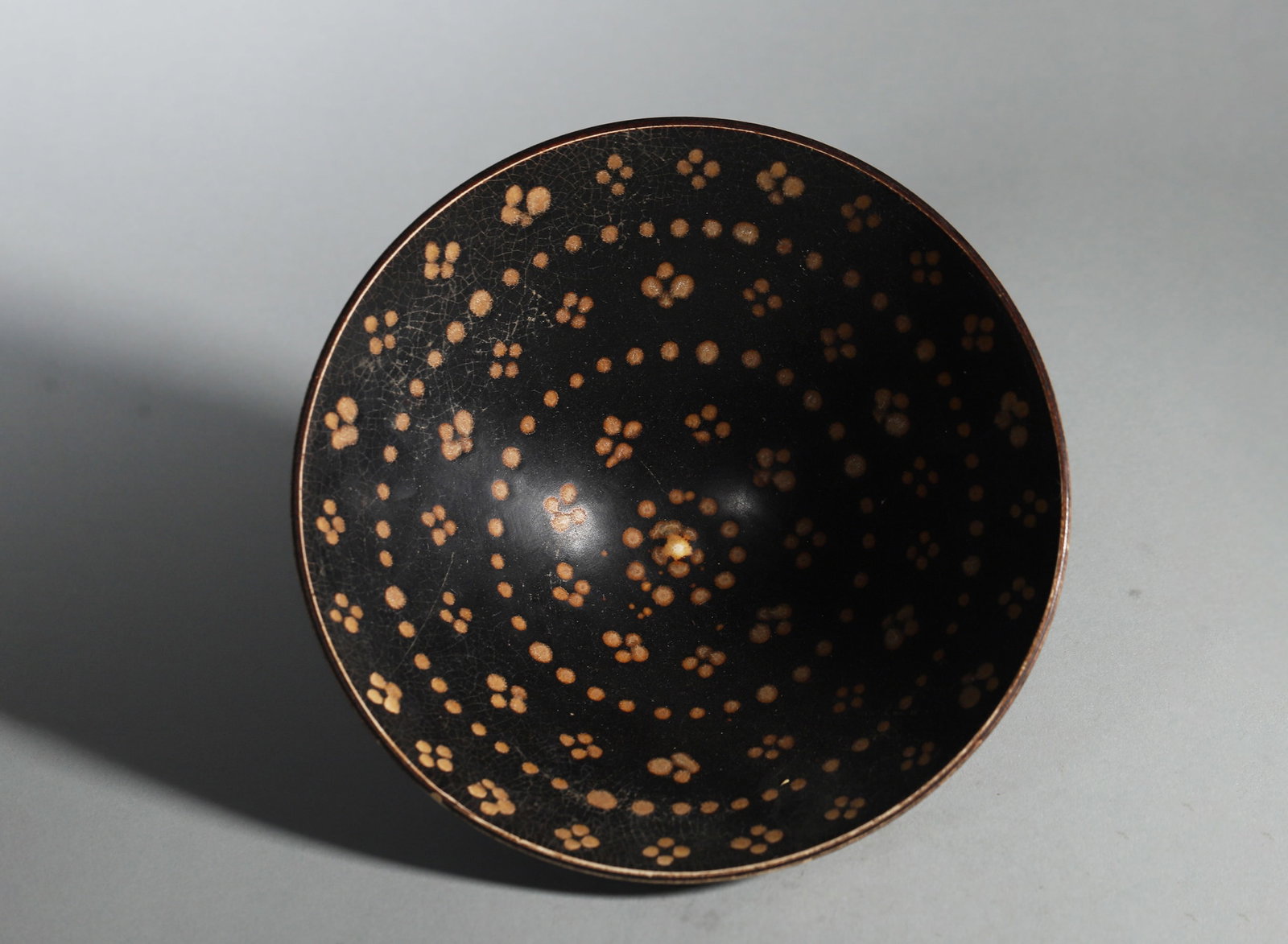 A Jizhou Kiln Black-Glazed Conical Tea Bowl with Star-Spot Decoration, Song Dynasty (1 of 5)