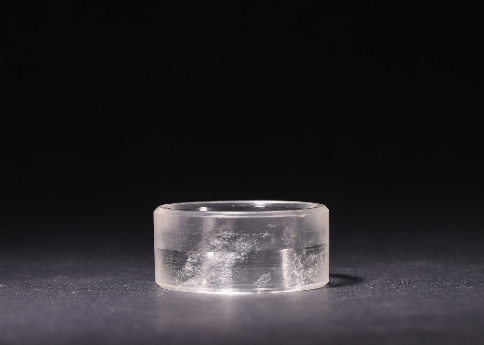 A Rock Crystal Ring, Warring States-Han Dynasty: D 7.0cm (2.76 in); H 10.7cm (4.21 in); Wt 551.0g (1.21 lb)A Han Dynasty jade tortoise-knob seal with matching hunting-pattern case, carved from natural jade with reddish-brown patina. The seal has an 