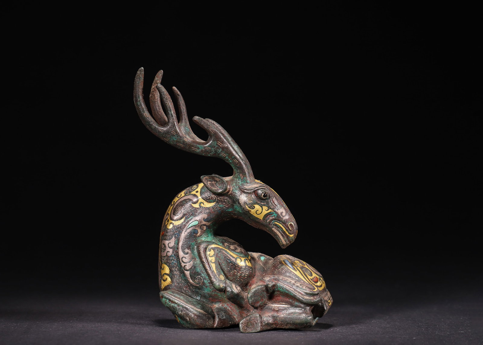 A Bronze Gold and Silver Inlaid Recumbent Deer Ornament, Han Dynasty (1 of 8)