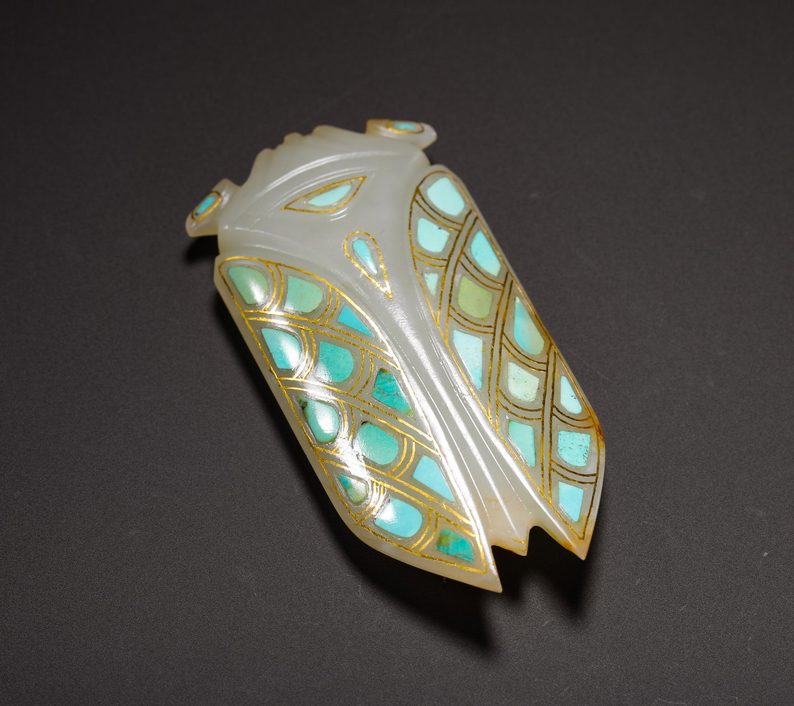 WHITE JADE WITH GOLD INLAID WITH TURQUOISE JADE CICADAS FROM THE HAN DYNASTY: H:6.5cmW:3.2cmWeight:30g Luxury jade cicada ornament with gold wire and turquoise inlay, elite burial & wearable jade of Han Dynasty.