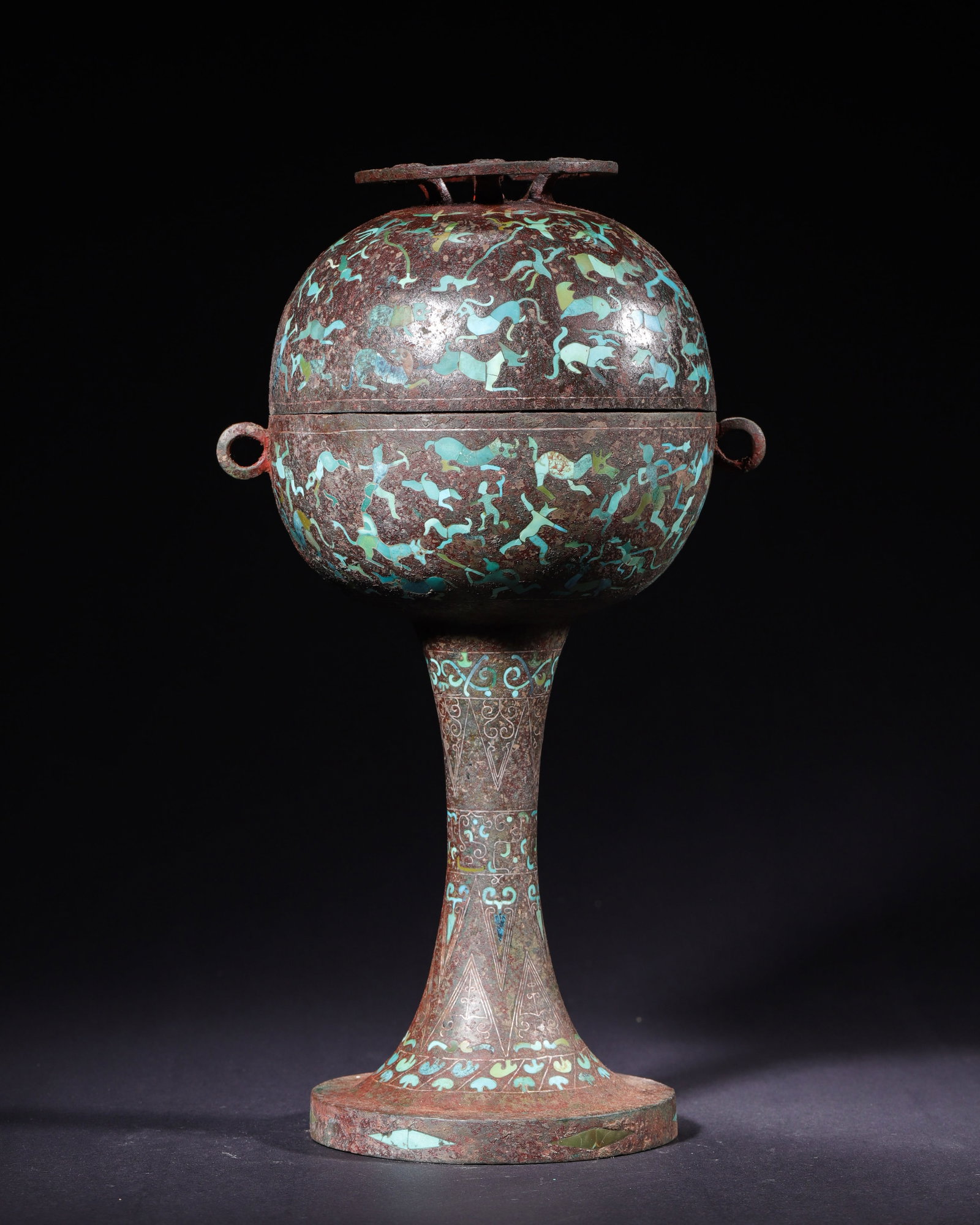 WARRING STATES PERIOD, BRONZE STEMMED DOU FULLY INLAID WITH TURQUOISE HUNTING SCENE: H 31.00cm (12.20 in); D 14.00cm (5.51 in); Wt 1951.00g (4.30 lb),Warring States ritual food vessel stemmed dou, composed of lid, body, tall stem and circular foot, bronze core covered in thick reddish