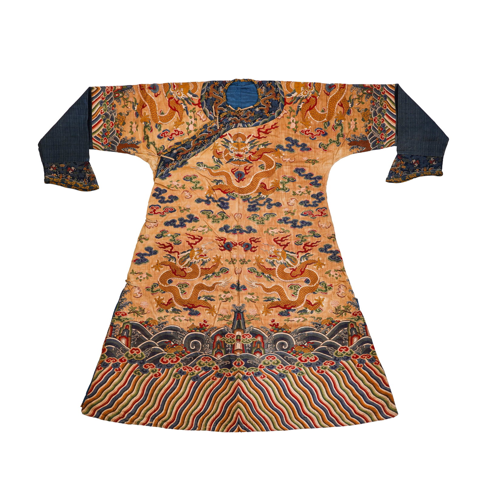 QING DYNASTY, APRICOT-YELLOW GROUND KESI NINE-DRAGON PATTERNED IMPERIAL ROBES: H:136cm(53.54in) W:199cm(78.35in)This dragon robe is a national treasure of Qing Dynasty court attire. With an apricot-yellow kesi base, it adopts the "passing warp and breaking weft" kesi technique t
