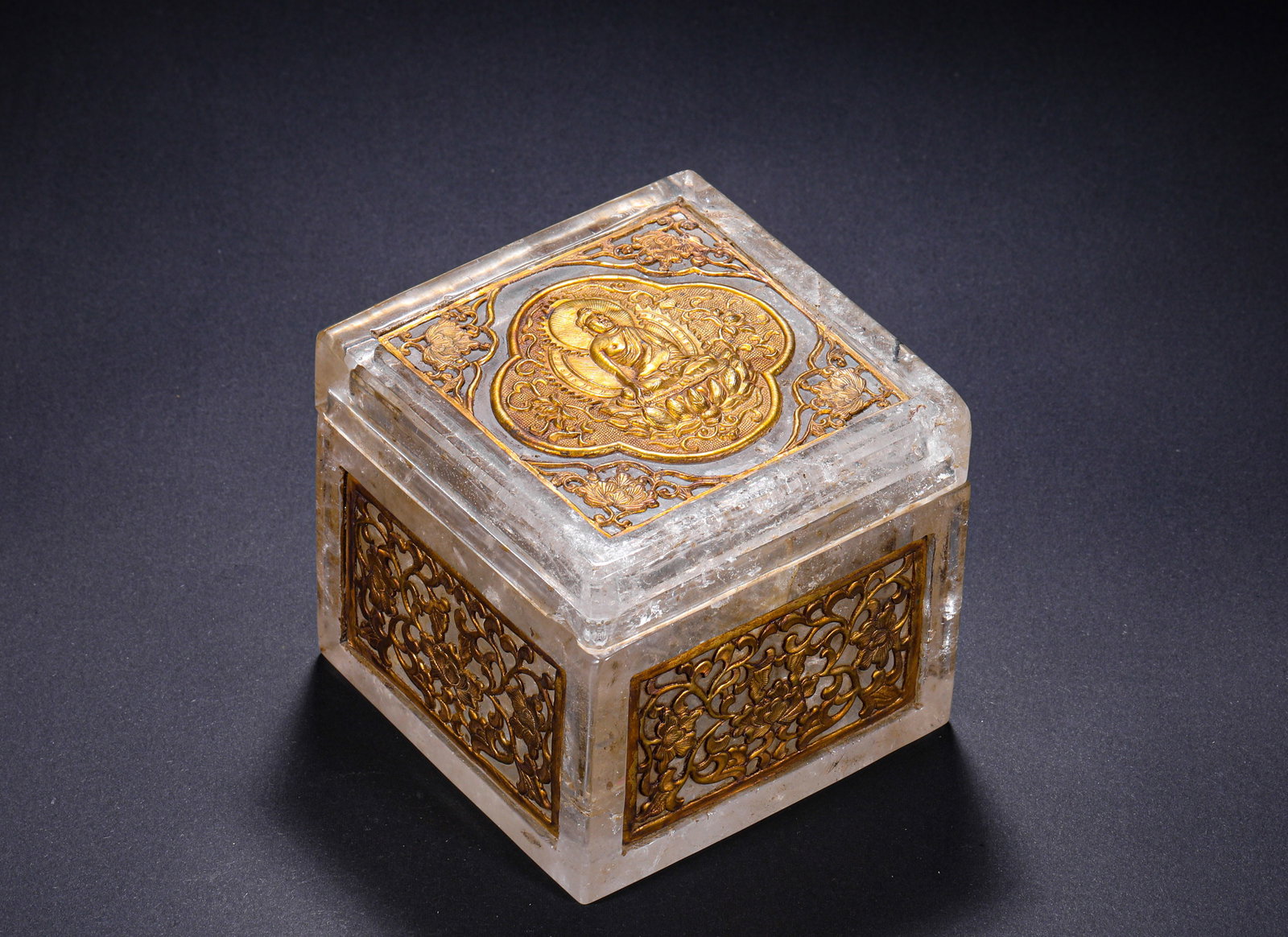 TANG DYNASTY WHITE CRYSTAL GOLD INLAID BUDDHA PATTERN SQUARE RELIC BOX: H:9.0cm(3.54in) W:9.8cm(3.86in) Weight:990g(2.18lb)This sarira casket is a top-tier ritual vessel for Tang Dynasty Buddhist pagoda palace, carved from a single piece of natural rock crystal. The caske