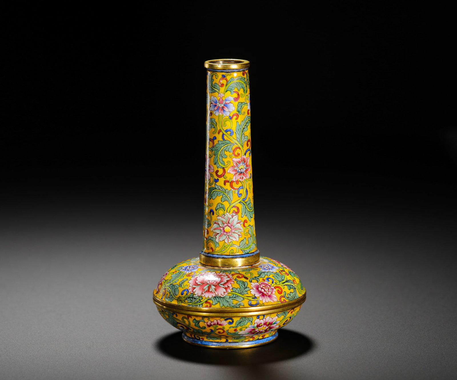 QING DYNASTY QIANLONG COPPERPLATE PAINTED ENAMEL LONG NECK FUMIGANT: Height:10cm(3.94in) Width:6cm(2.36in) Weight:110g(0.24lb)Qing Qianlong copper painted enamel long-neck incense burner with scrolling peony flowers on yellow ground. Fully gilded bronze body covered wi