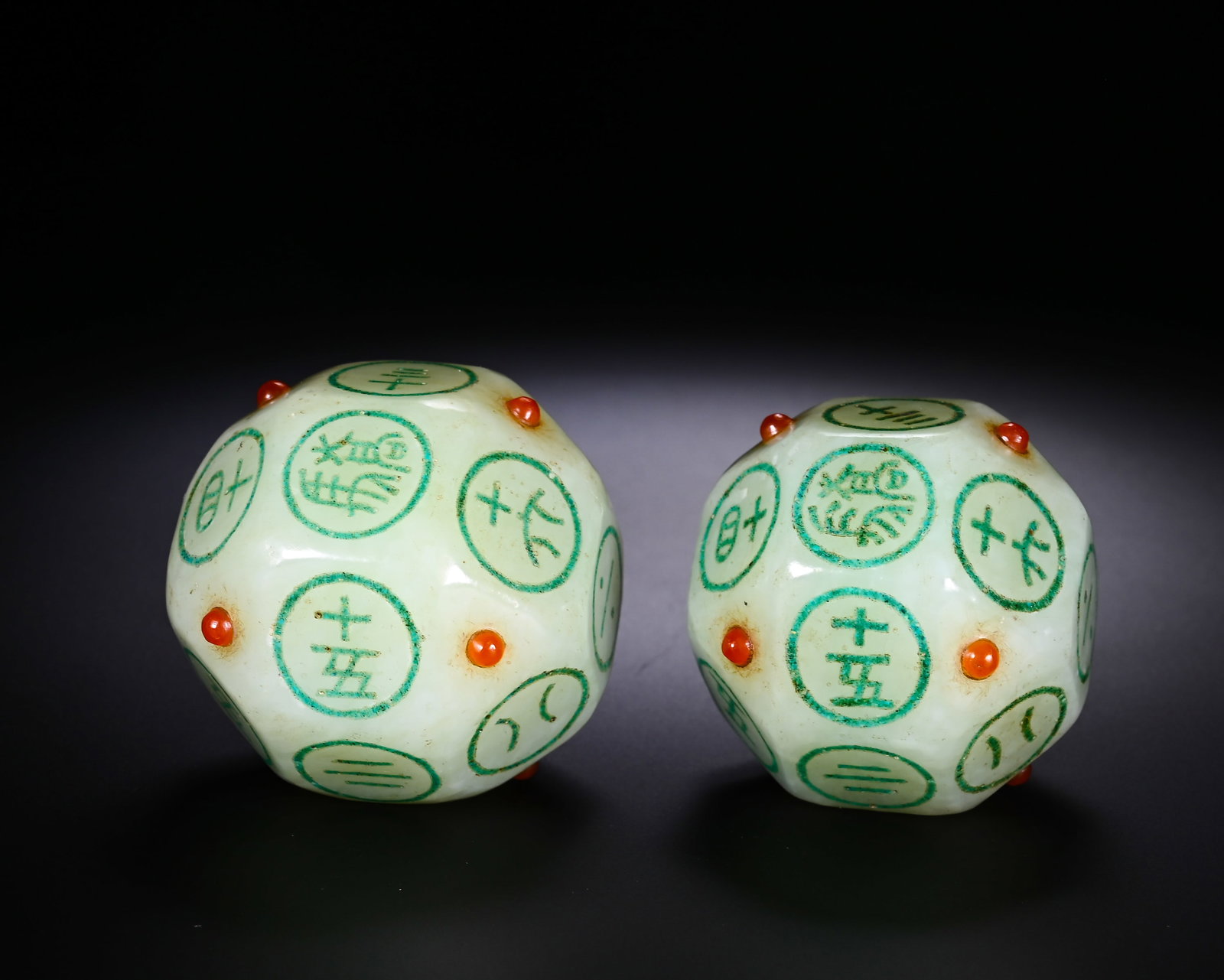HAN DYNASTY HETIAN WHITE JADE DODECAHEDRAL GAME DICE: D:4cmWeight:260gPair of twelve-sided gaming dice carved from Han Dynasty Hetian white seed jade. Fully polished single nephrite block with greasy texture, naturally formed earth patina and aged stains