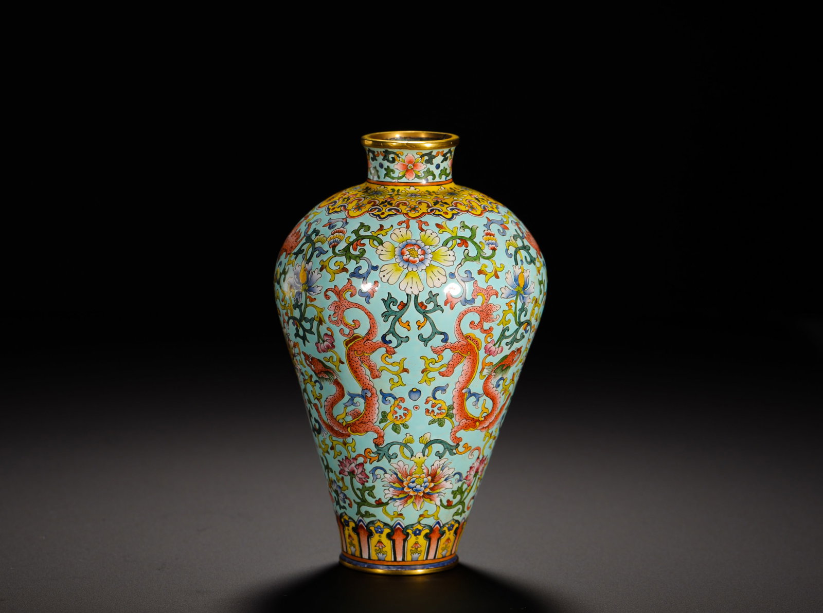 QING DYNASTY QIANLONG COPPERPLATE PAINTED ENAMEL PLUM VASE: Height:13cm(5.12in) Width:8.5cm(3.35in) Weight:360g(0.79lb)Qing Qianlong gilt bronze enamel plum vase with red dragon and flower scrolls on turquoise ground. Gilded rim and foot, fully covered with in