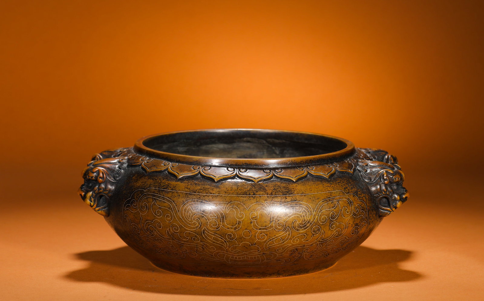 A BRONZE STOVE WITH TWO LION EARS INLAID WITH SILVER WIRE IN THE STYLE OF A STONE OLD MAN (1 of 10)