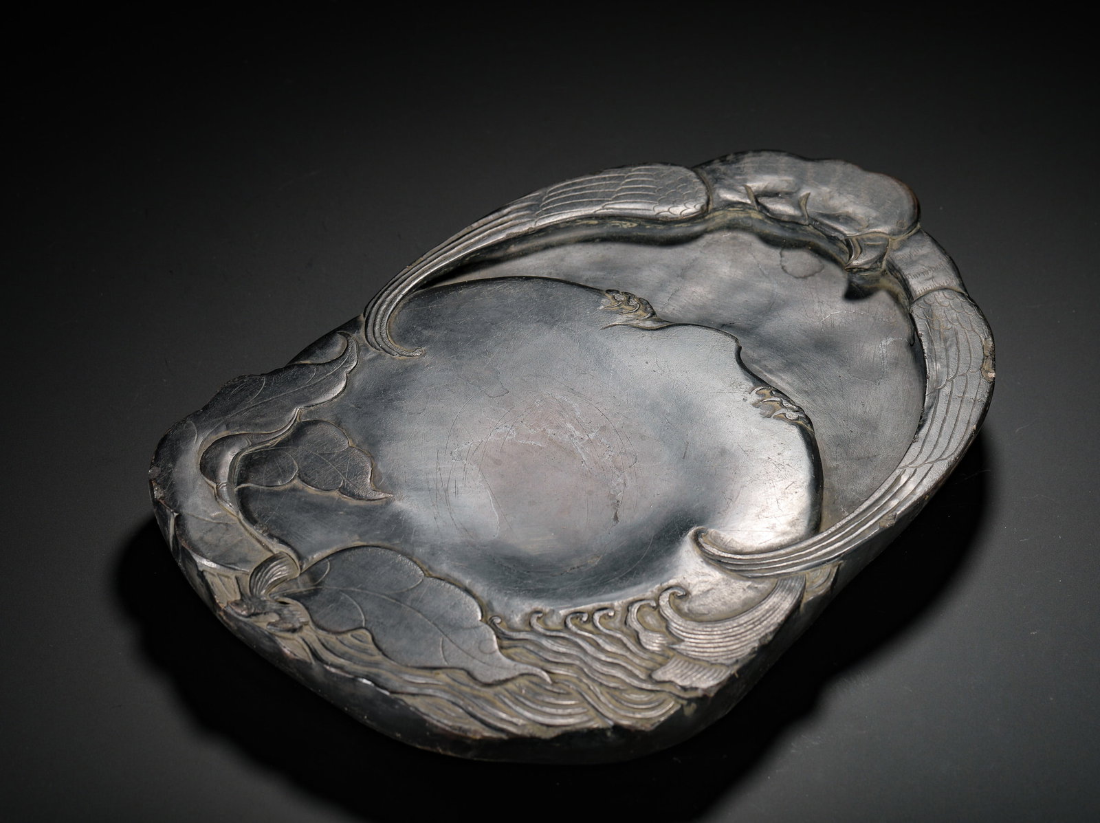 QING DYNASTY SHAPED FLOWER-AND-BIRD DUAN INKSTONE: Long:30cm(11.81in) Width:20cm(7.87in) Weight:3660g(8.07lb)Free-form jade inkstone carved flower and bird, inscribed running script poetry, ancient scholar's stone